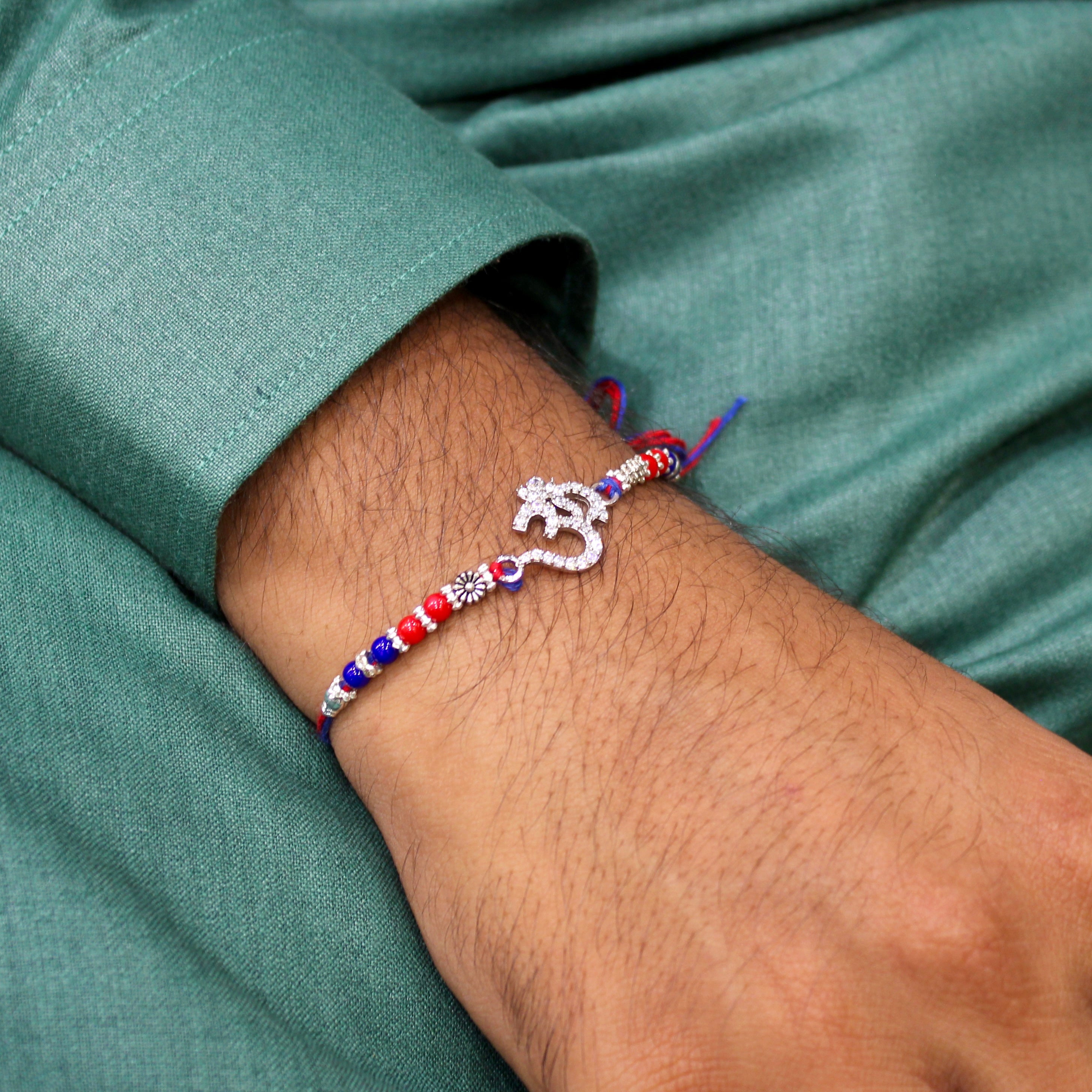 OM WITH ZIRCON STONES 925 silver red thread rakhi