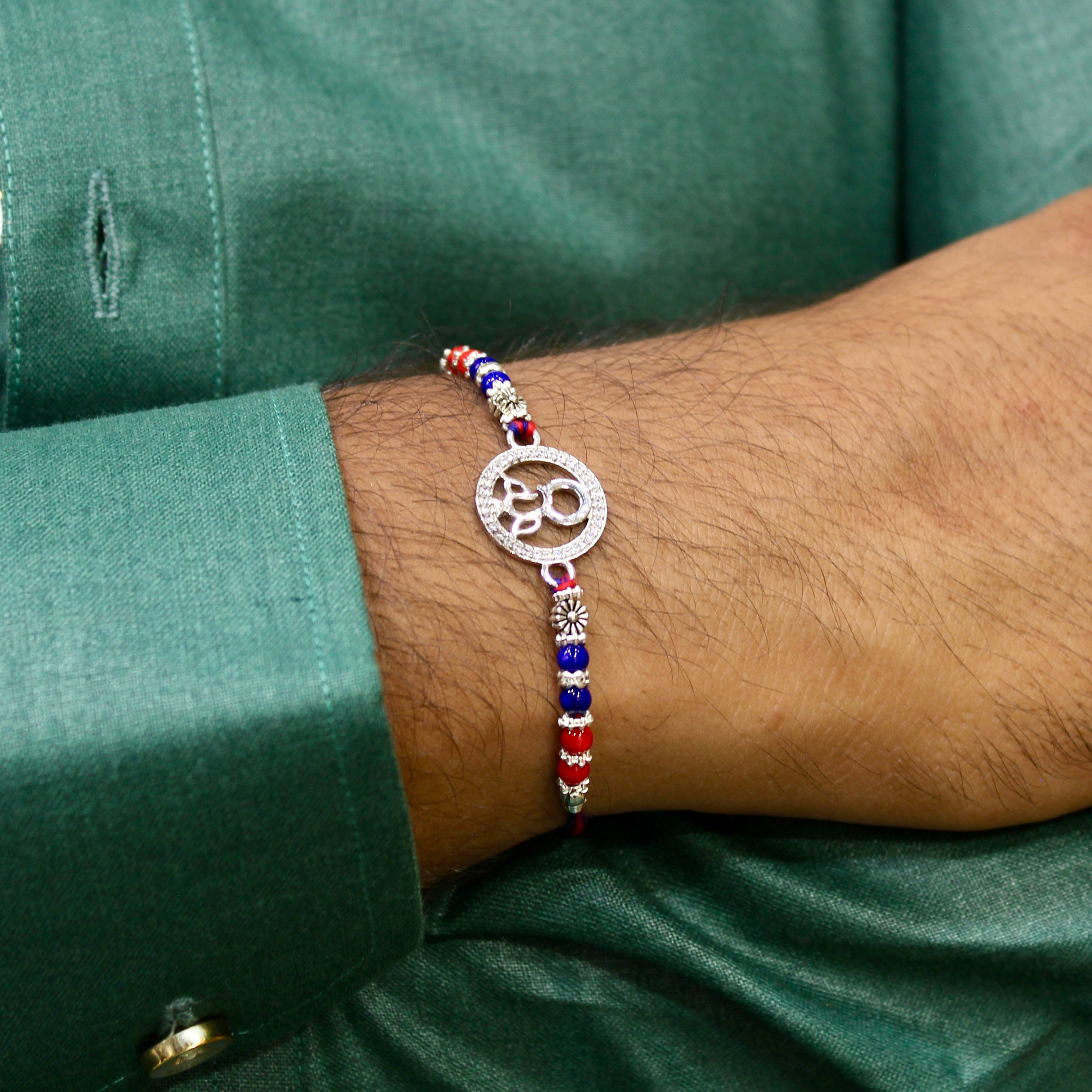 LORD GANESHA IN CIRCLE 925 silver red thread rakhi