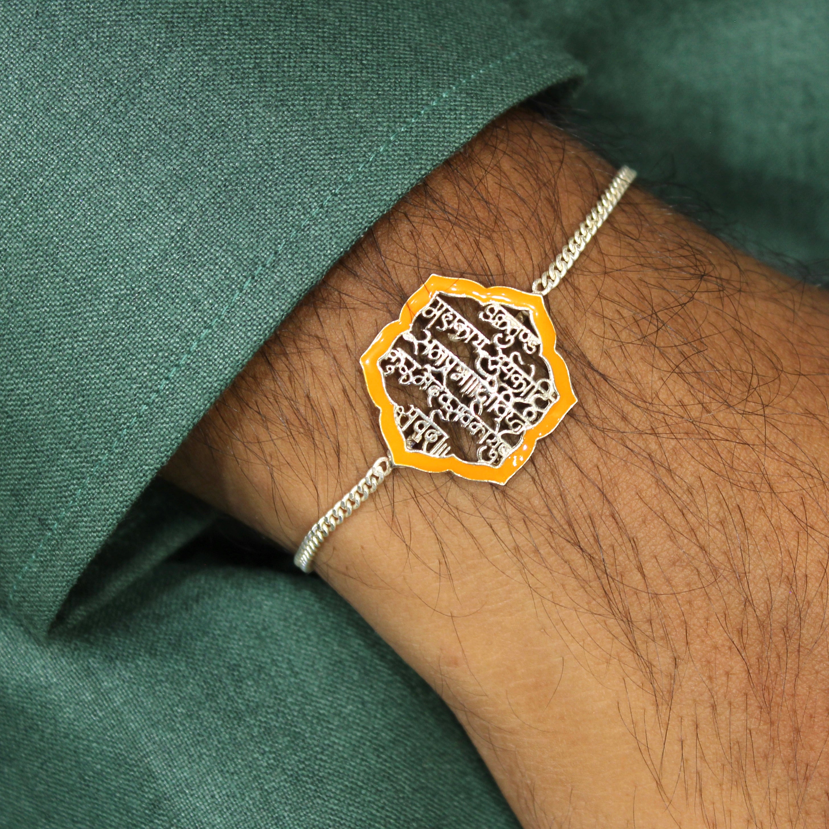 SHLOK orange chained rakhi in 925 silver
