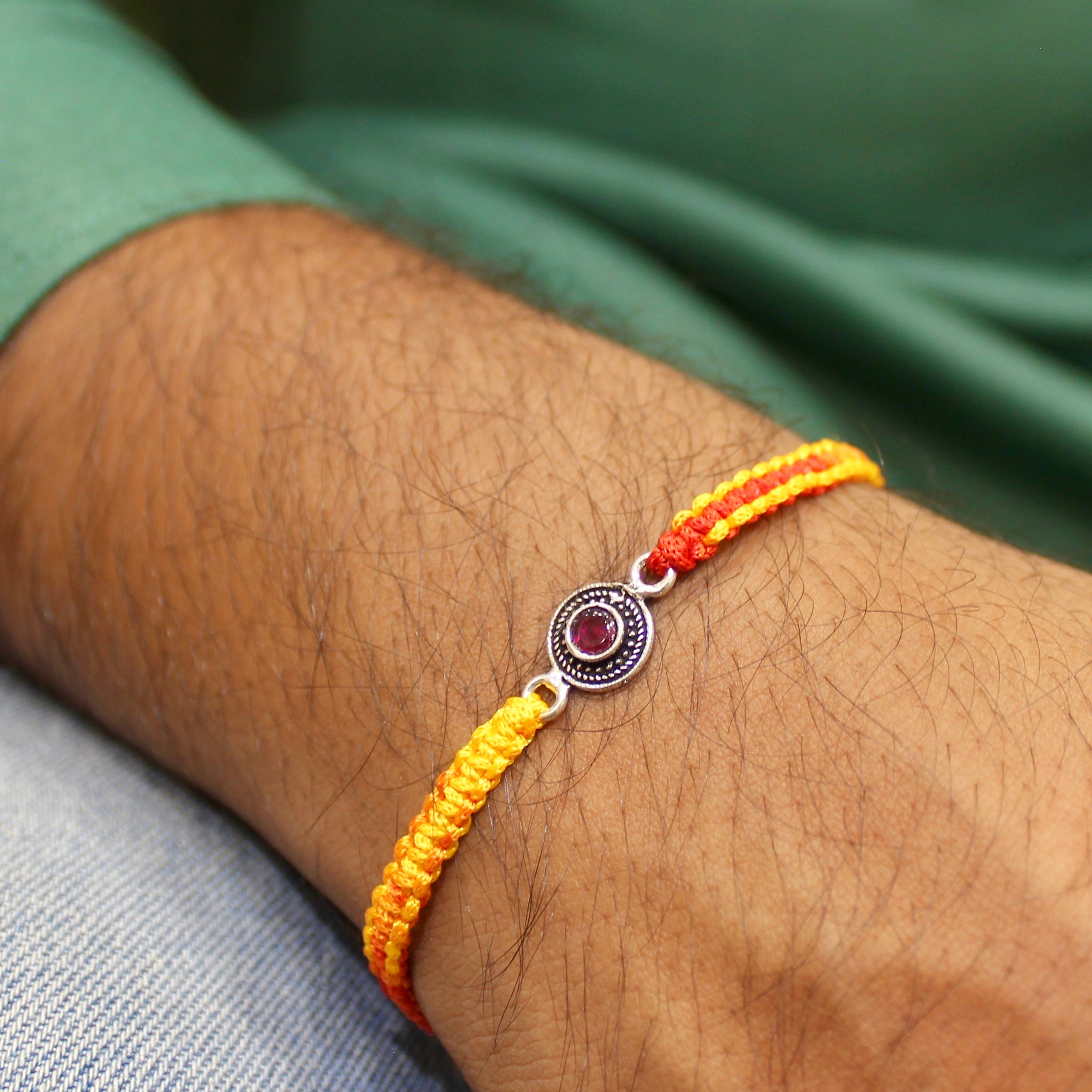 RUBY STONE mini circle red thread rakhi in 925 silver