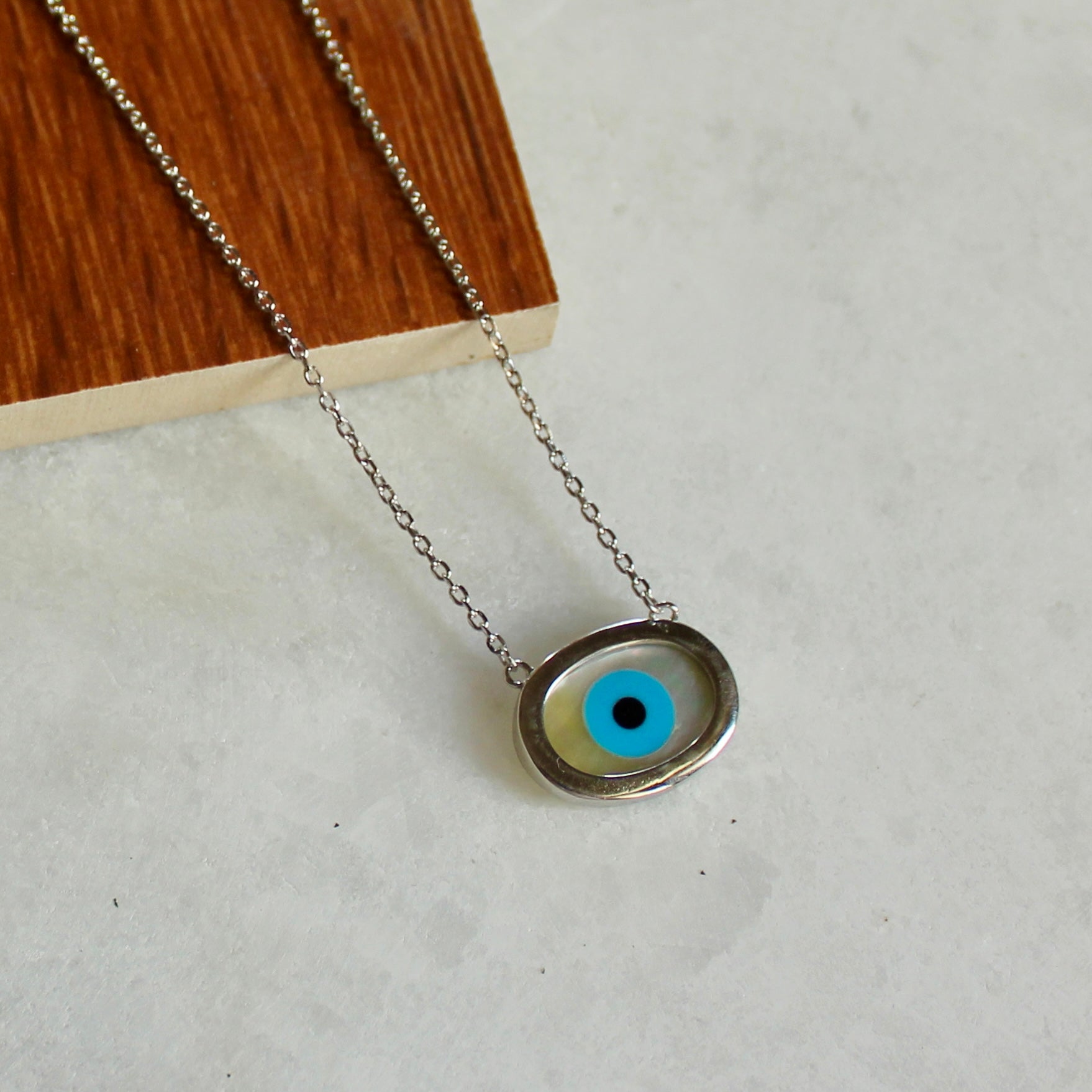 Evil eye oval silver pendant with chain