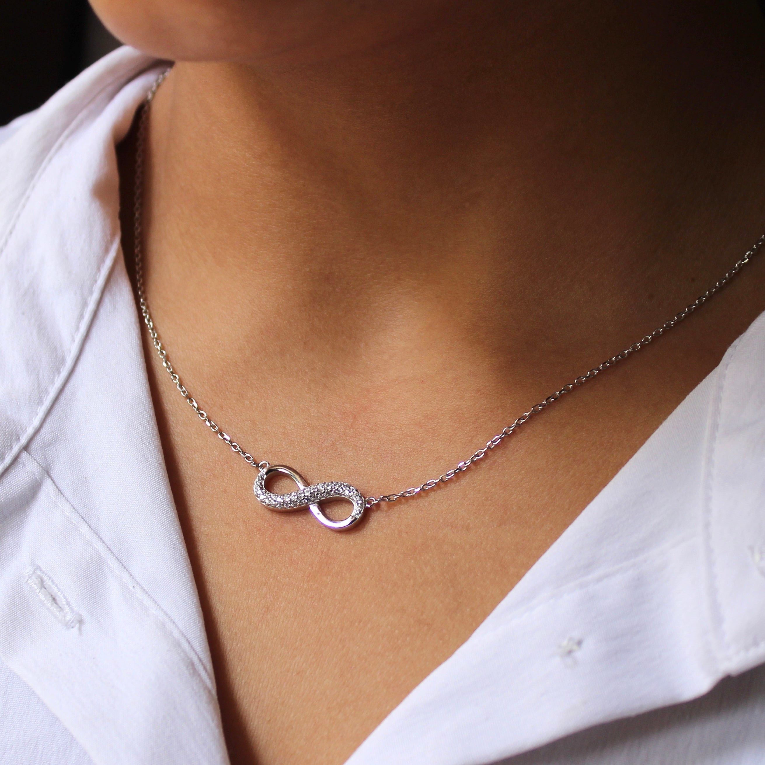 Infinity silver pendant with linked chain