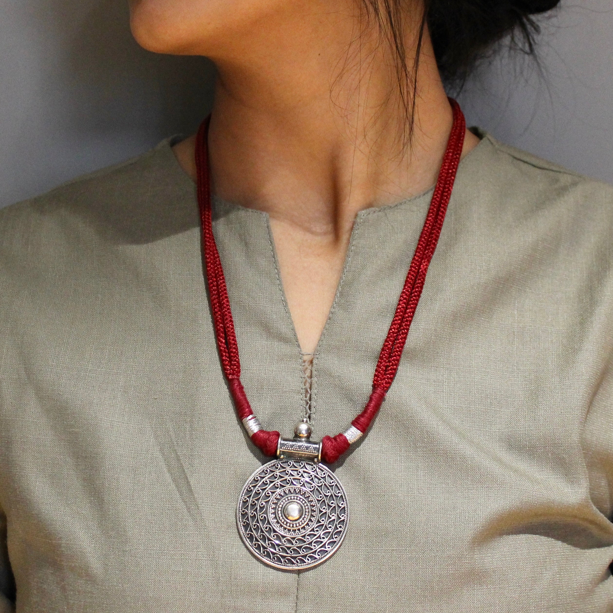 Oxidised circle pattered 925 silver with red dori necklace