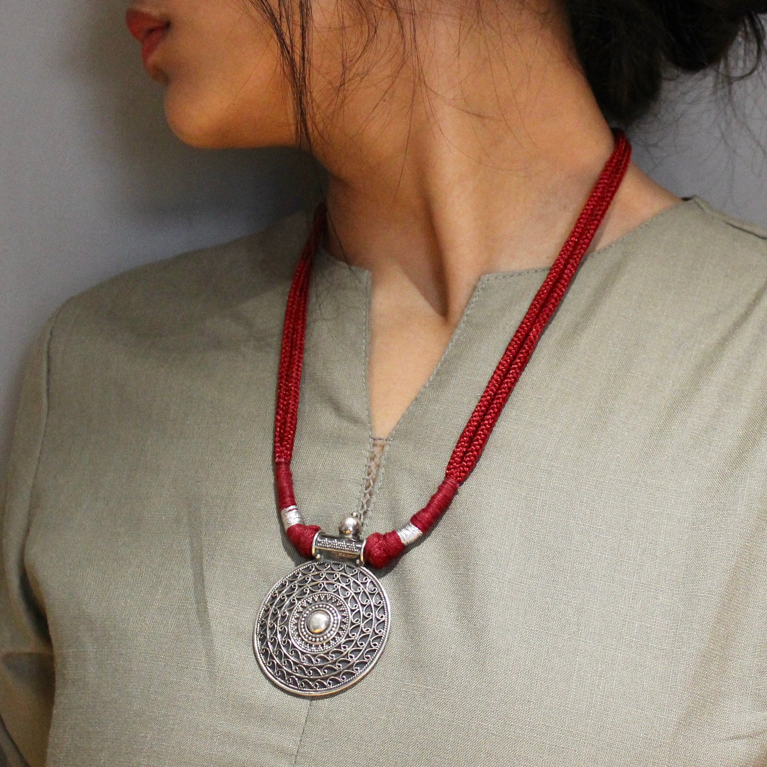 Oxidised circle pattered 925 silver with red dori necklace