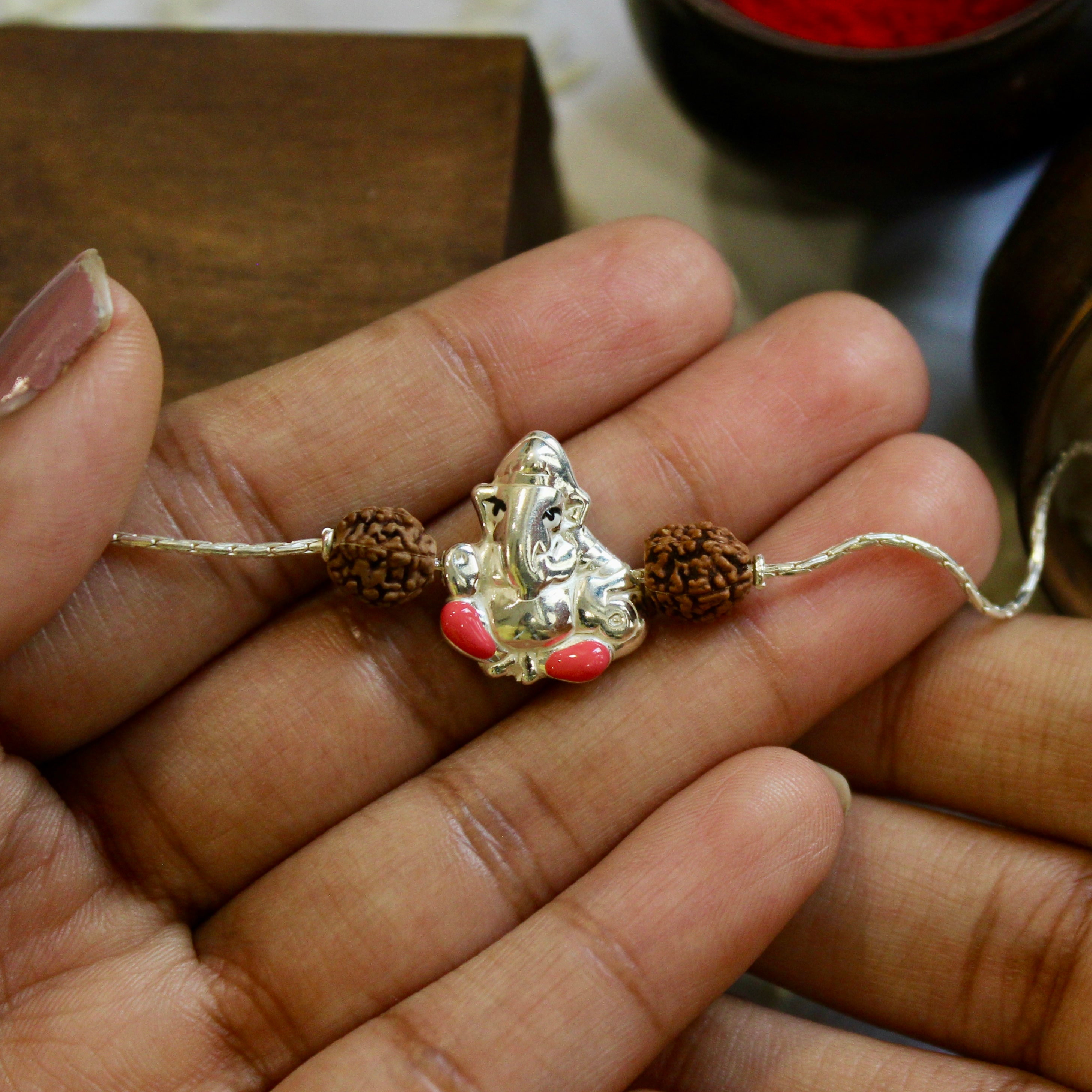Lord Ganesh and Laxmi ji Rudraksha Chained Rakhi in 925 Silver