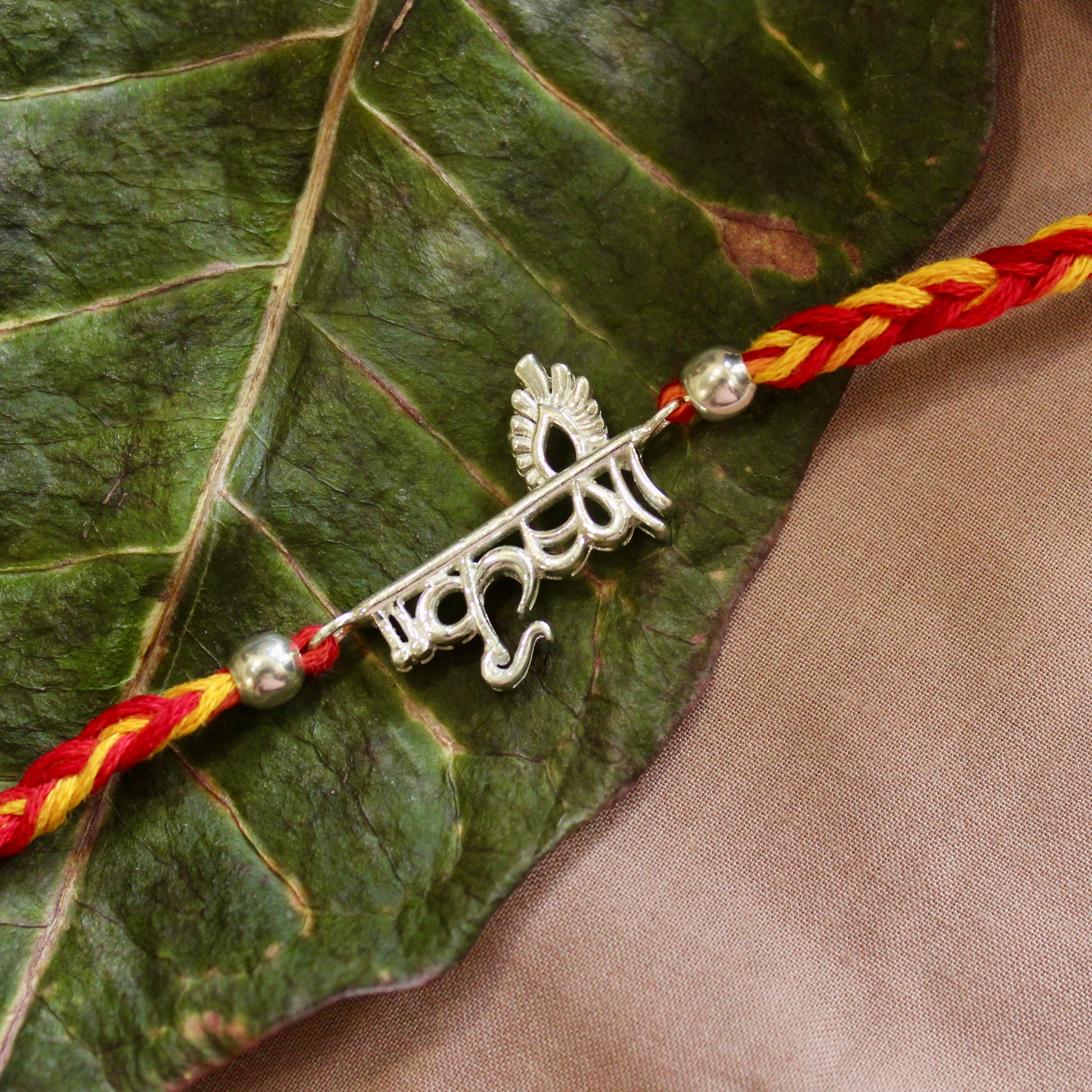 KRISHNA in hindi red yellow thread silver rakhi