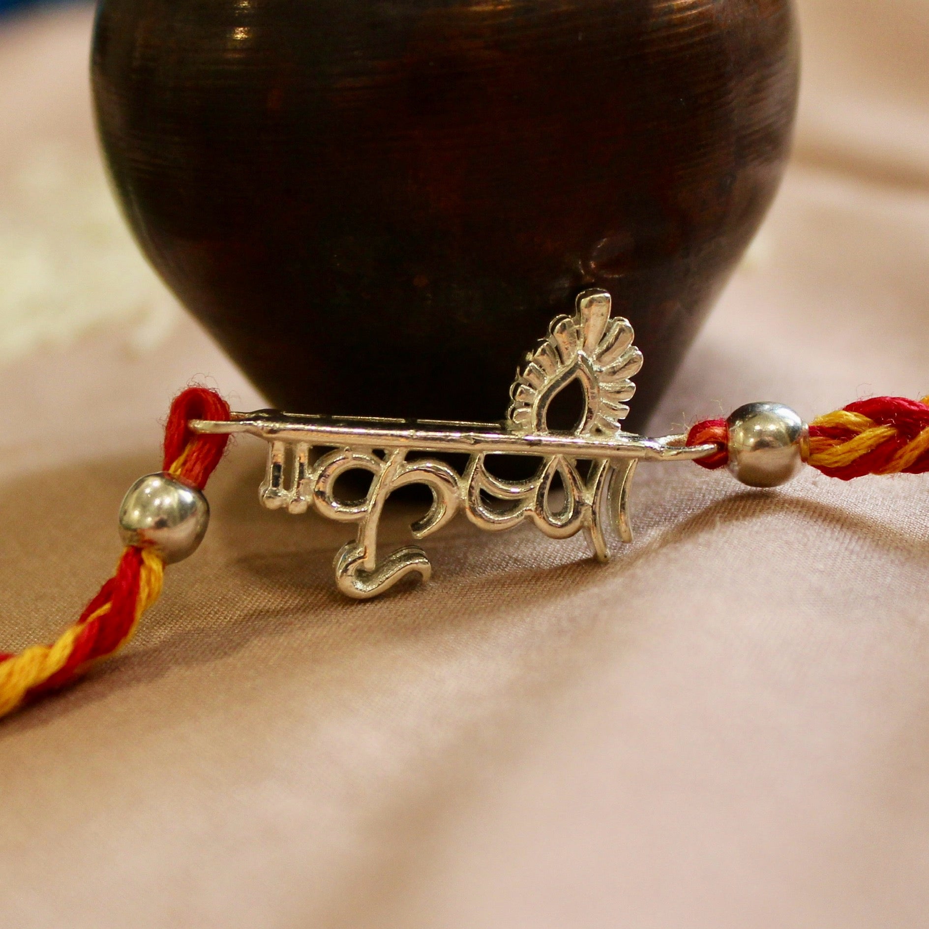 KRISHNA in hindi red yellow thread silver rakhi