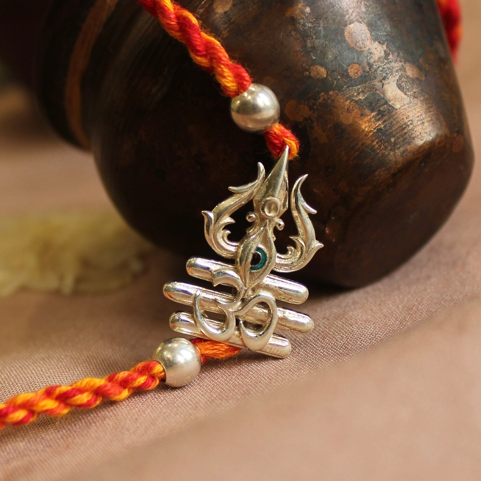 Trishul with eye red yellow thread silver rakhi