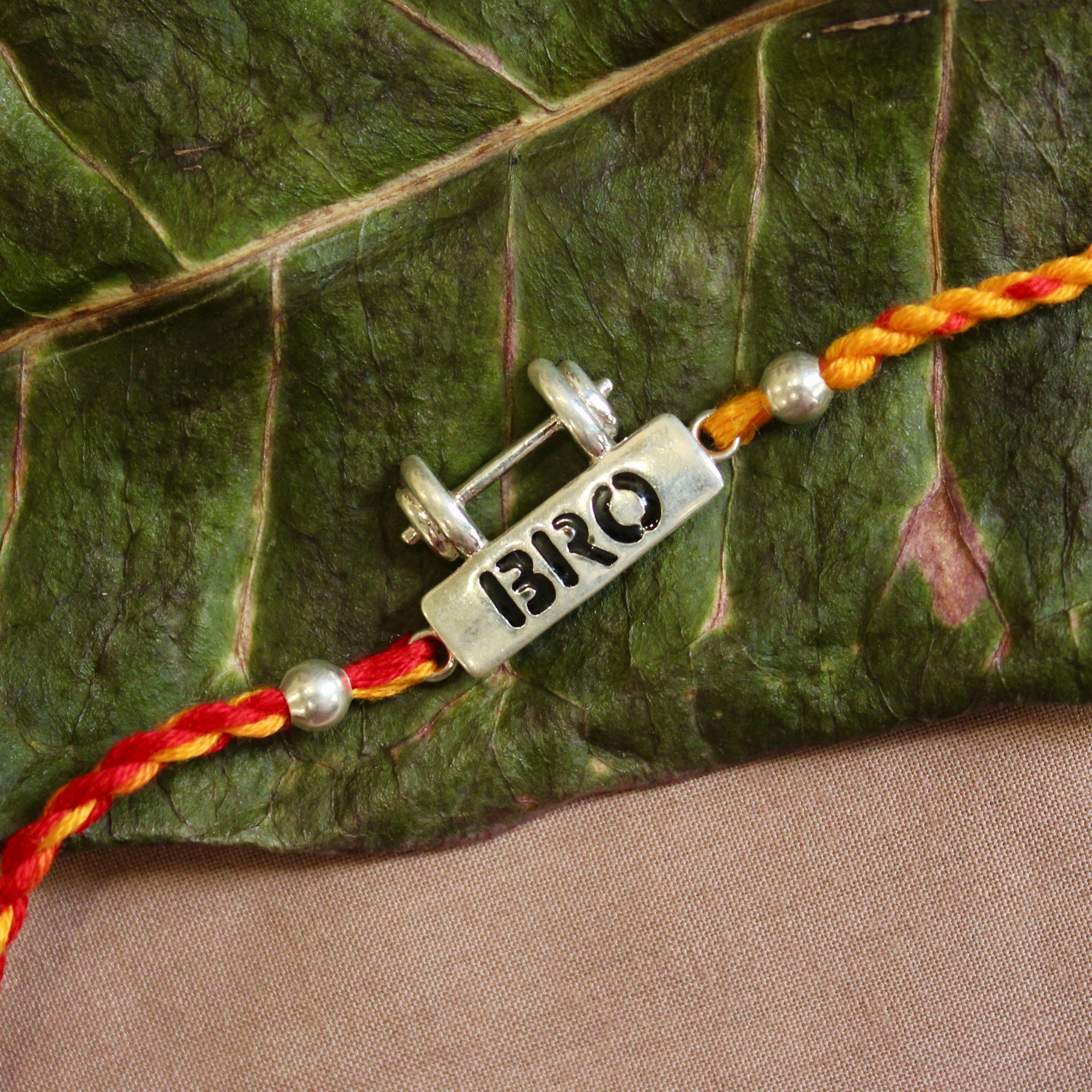 Bro with dumbell red yellow thread silver rakhi