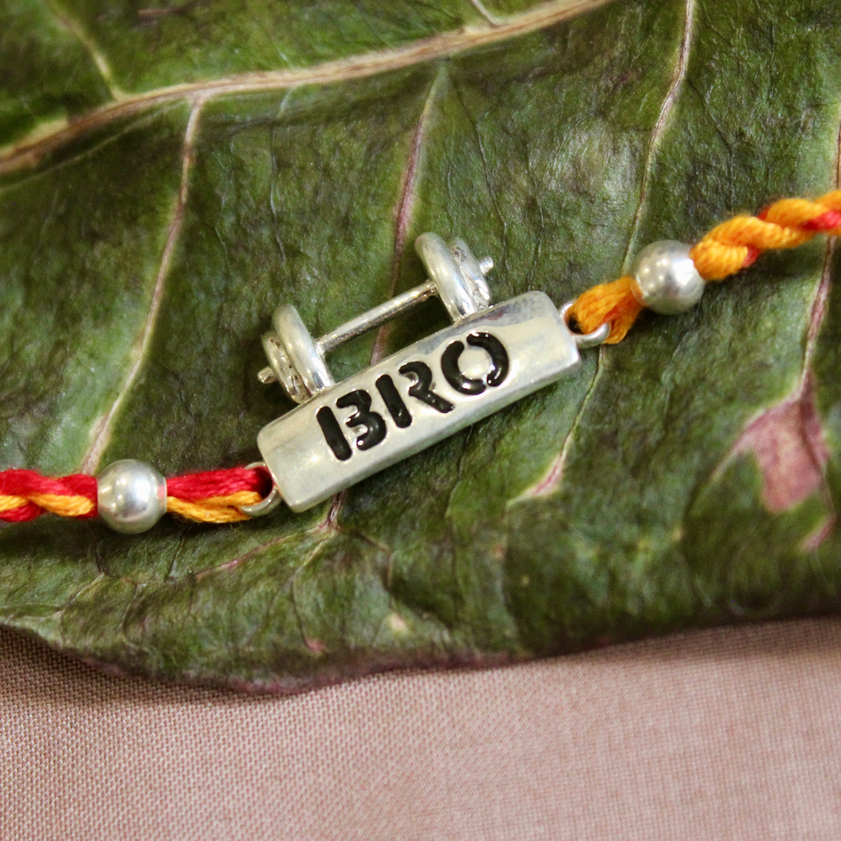 Bro with dumbell red yellow thread silver rakhi