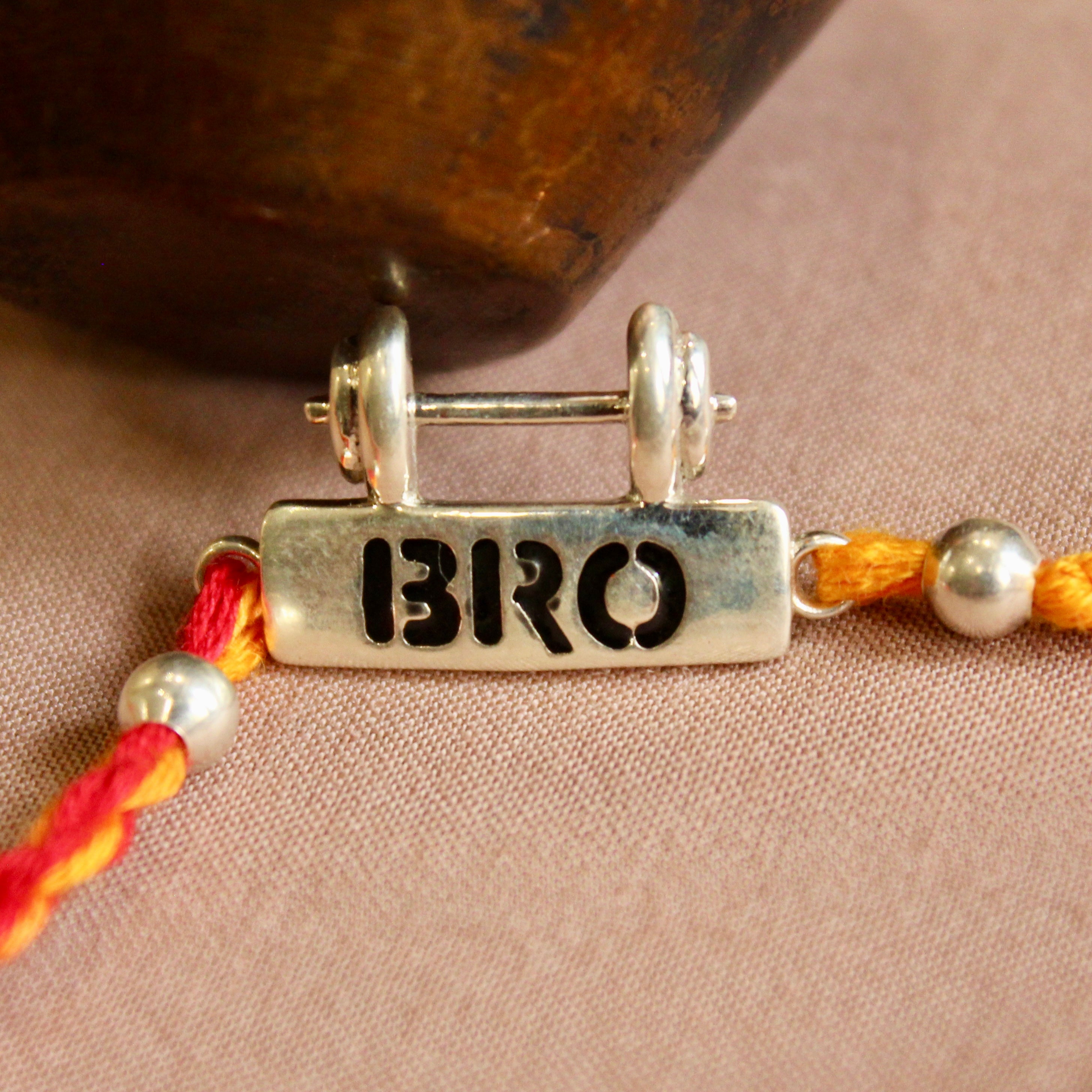 Bro with dumbell red yellow thread silver rakhi