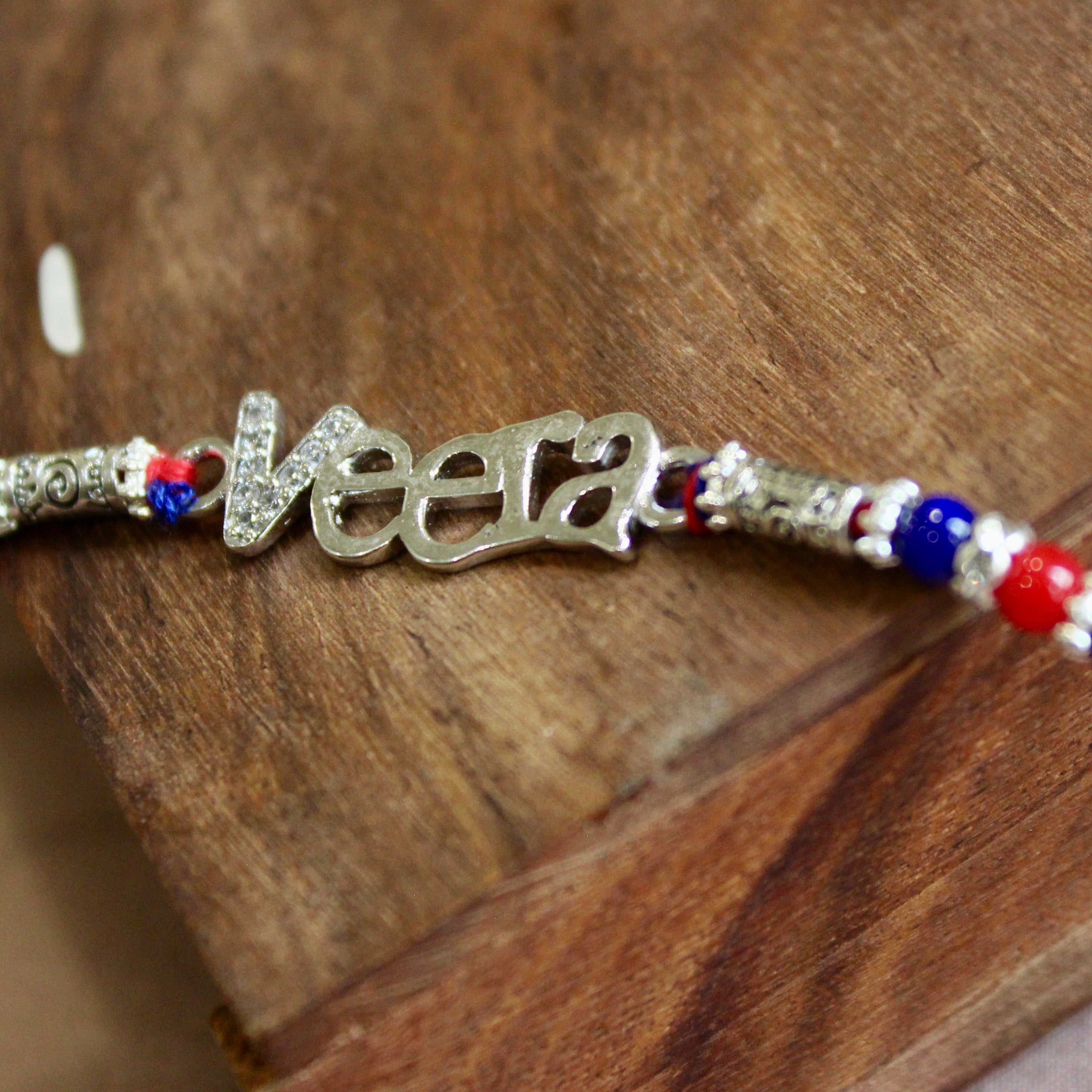 VEERA Red Thread Silver Rakhi