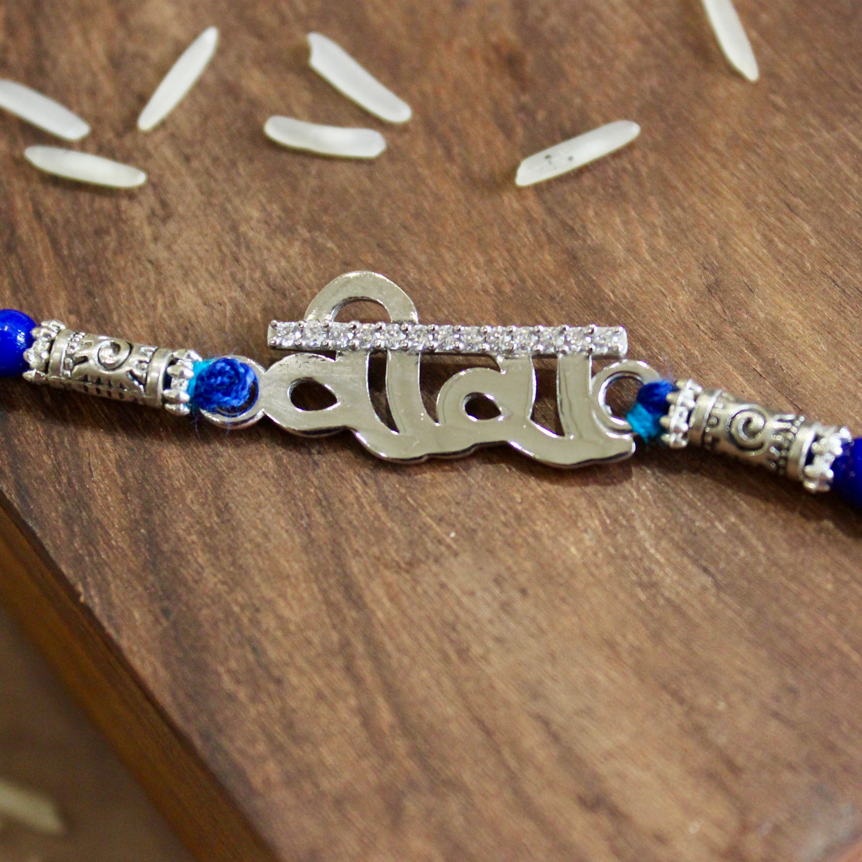 Veera silver blue thread rakhi