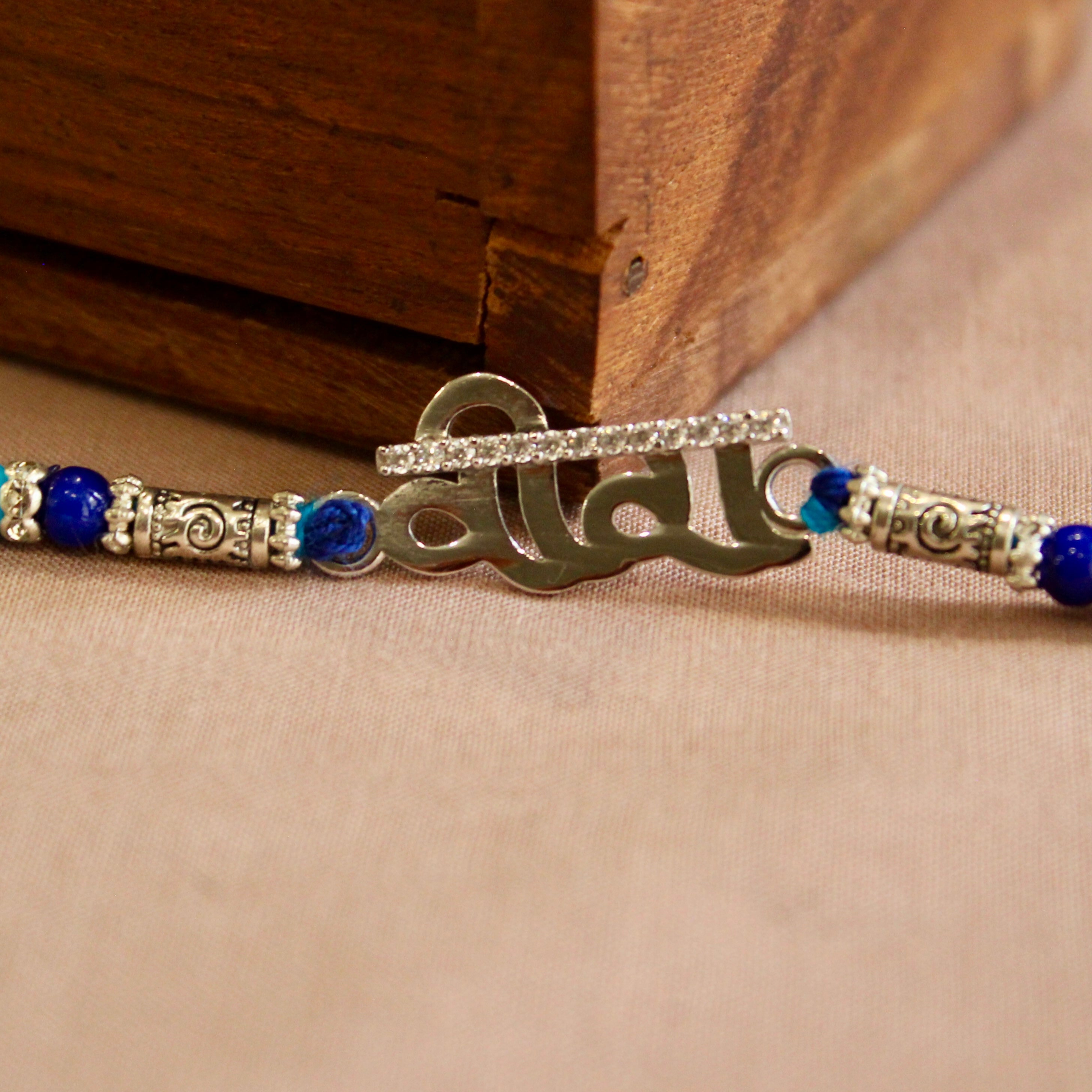 Veera silver blue thread rakhi