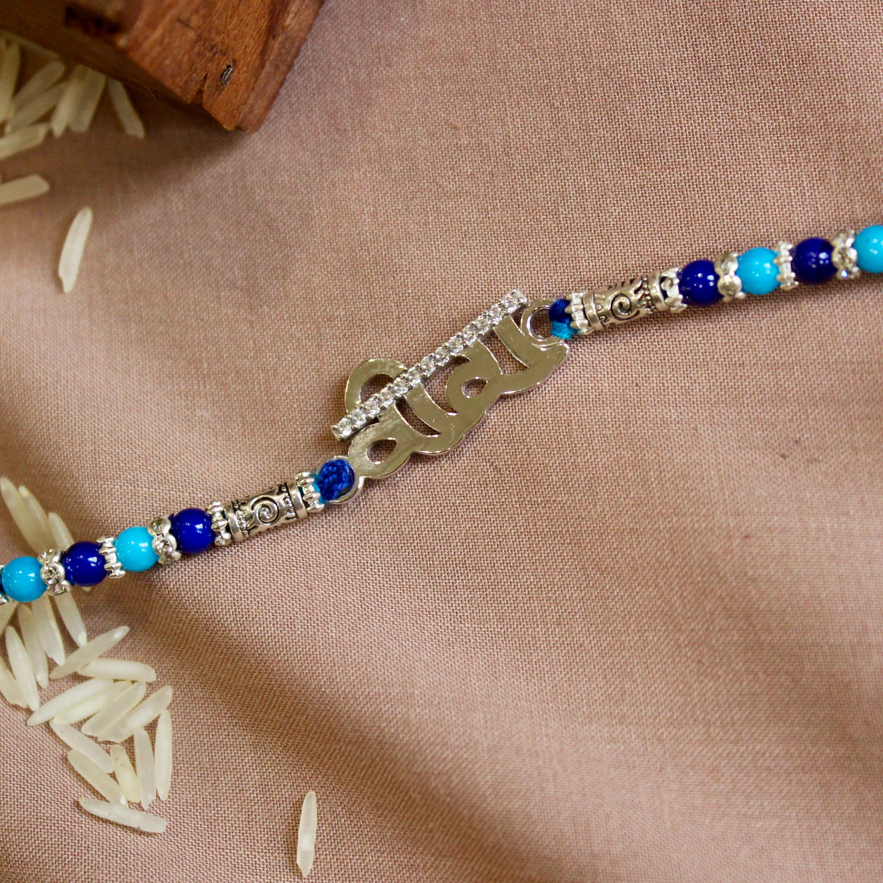 Veera silver blue thread rakhi