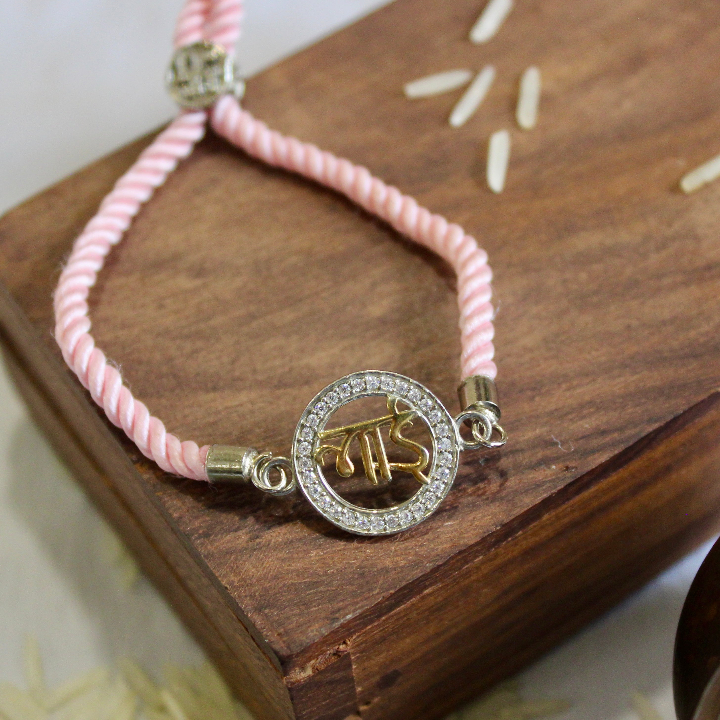 BHAI In Circle Silver Pink Thread Rakhi