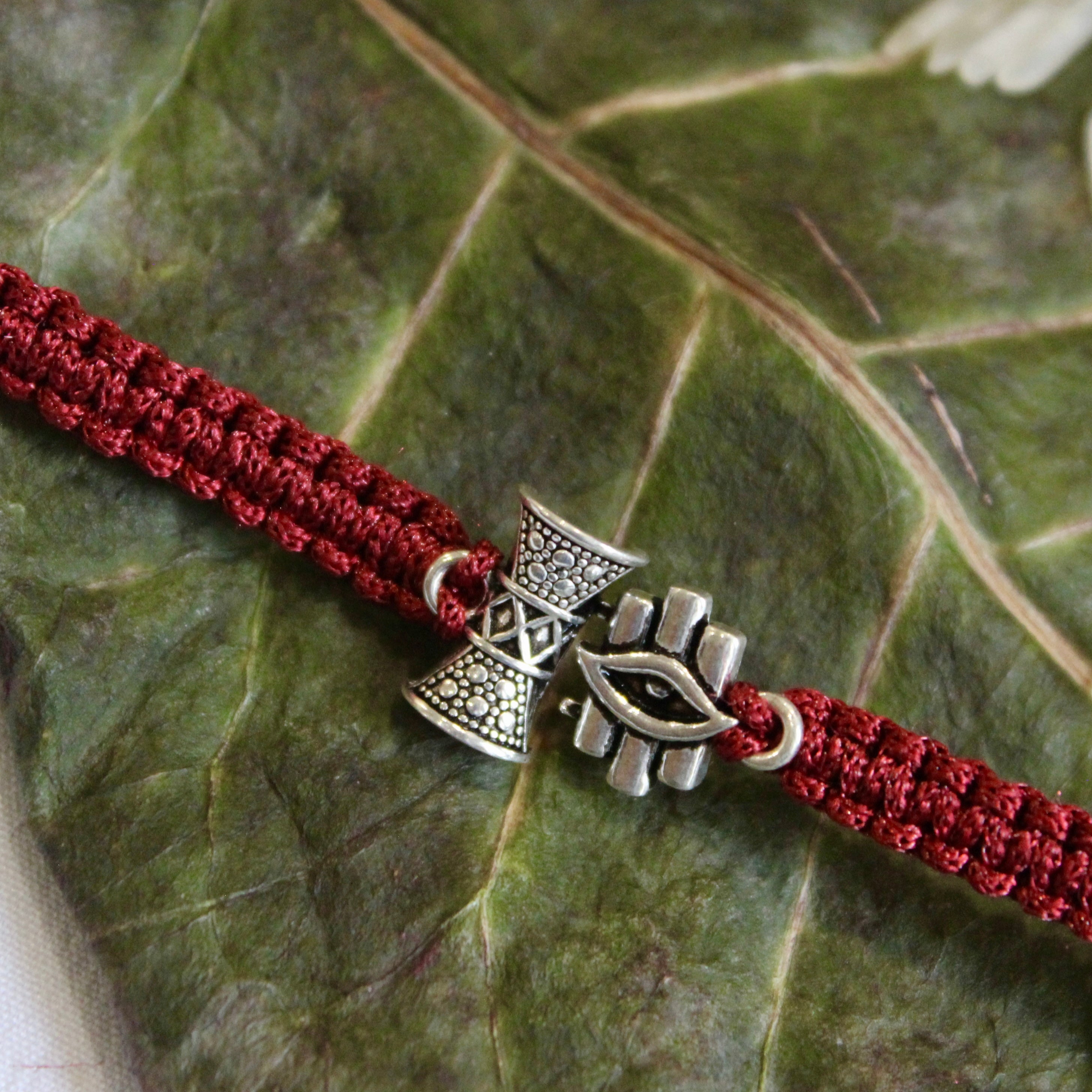 SHiv Damru and Eye Maroon Thread Silver Rakhi