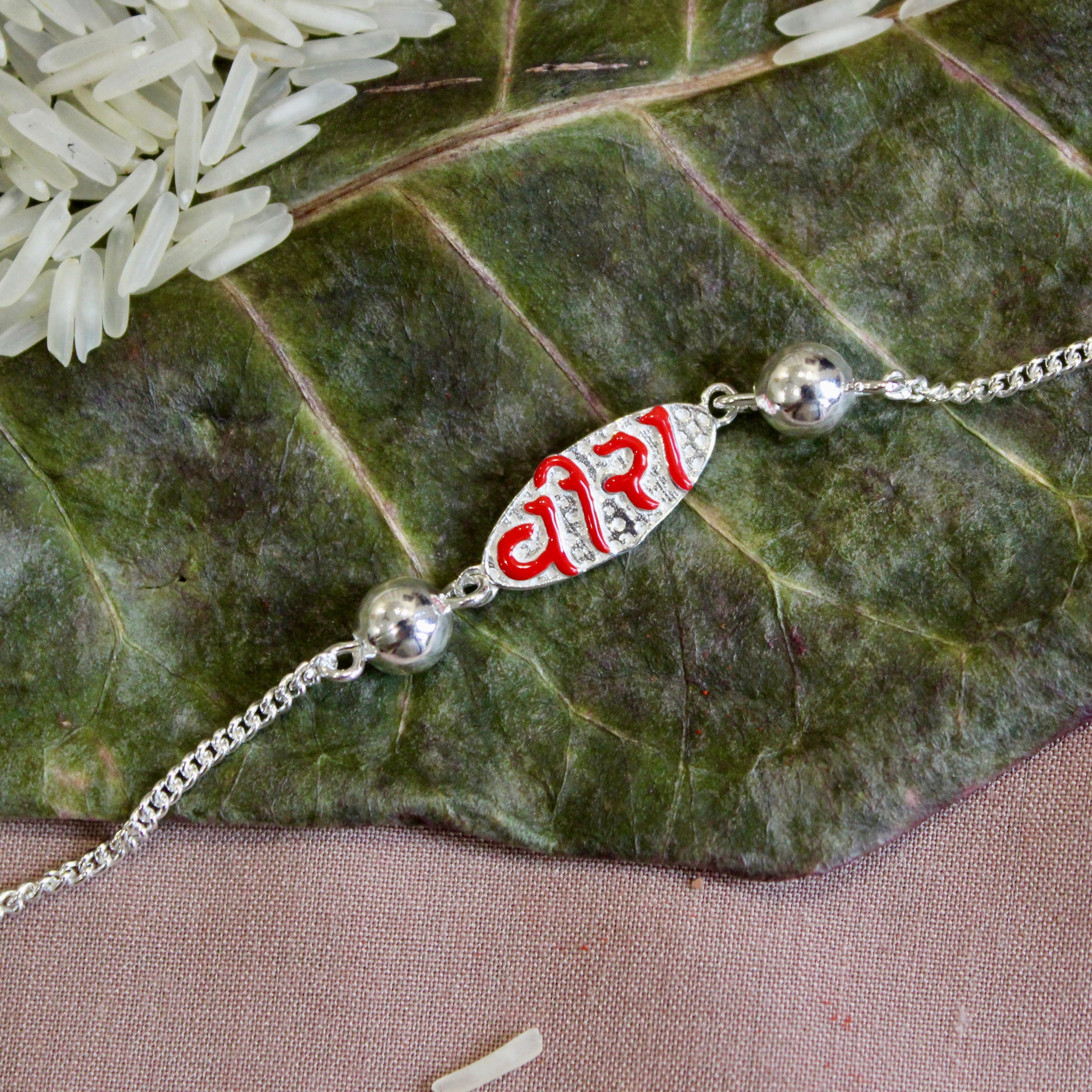 VEERA in Red Polish Silver Chained Rakhi