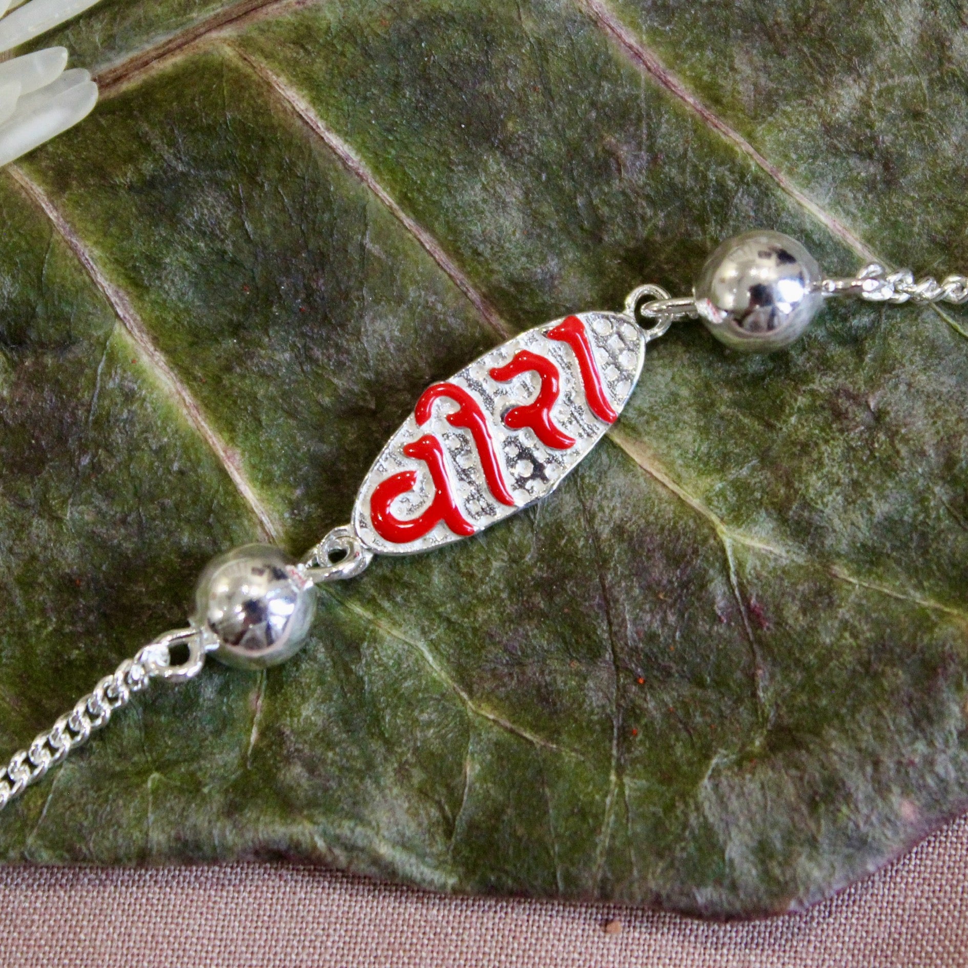 VEERA in Red Polish Silver Chained Rakhi