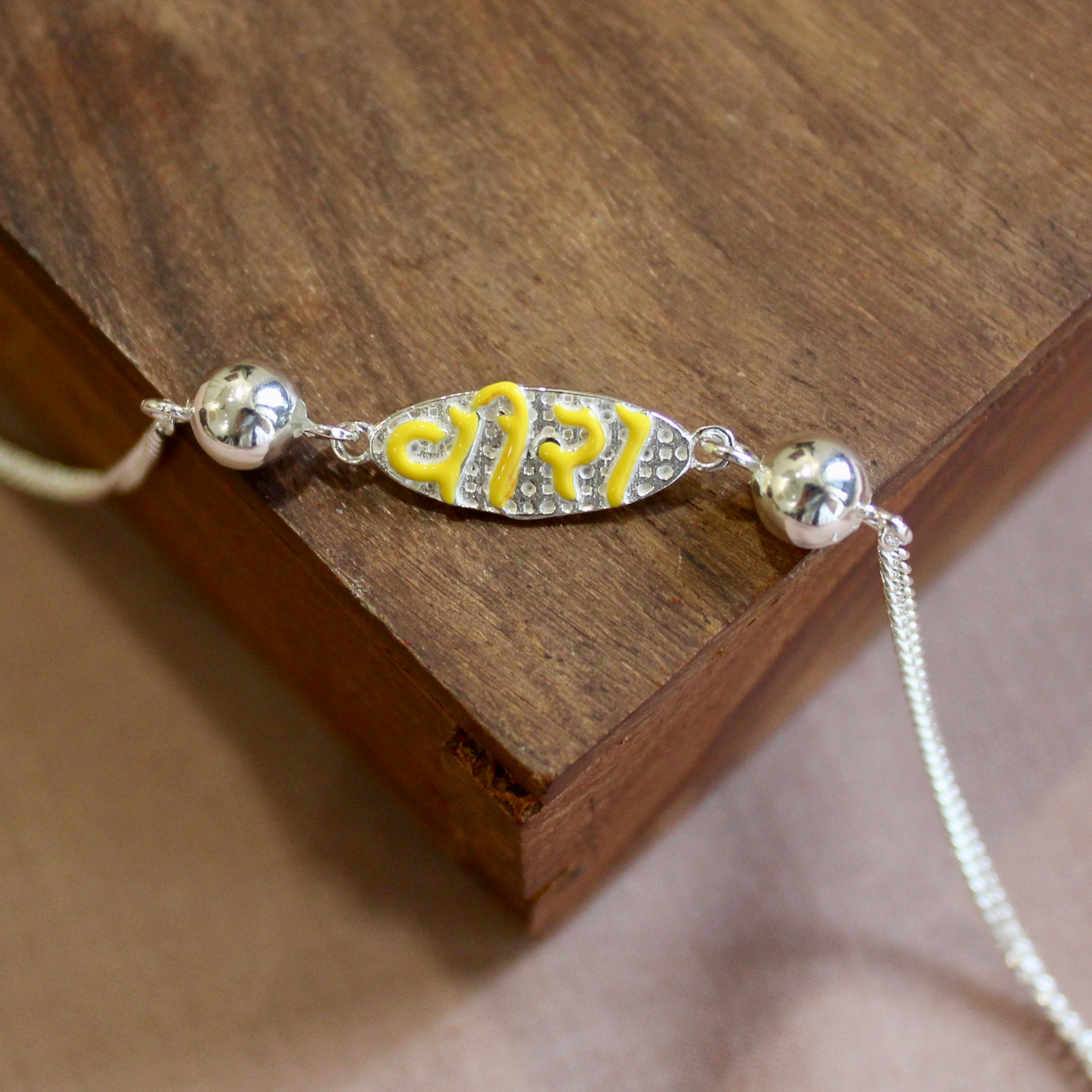 VEERA In Yellow Polish Silver Chained Rakhi