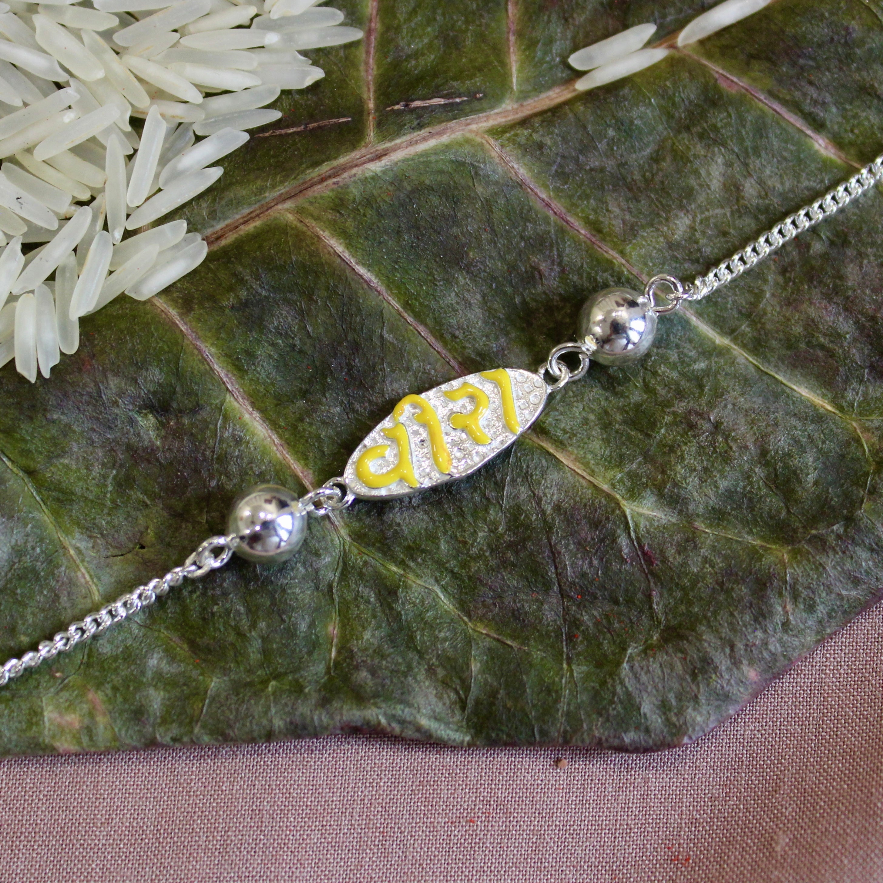 VEERA In Yellow Polish Silver Chained Rakhi