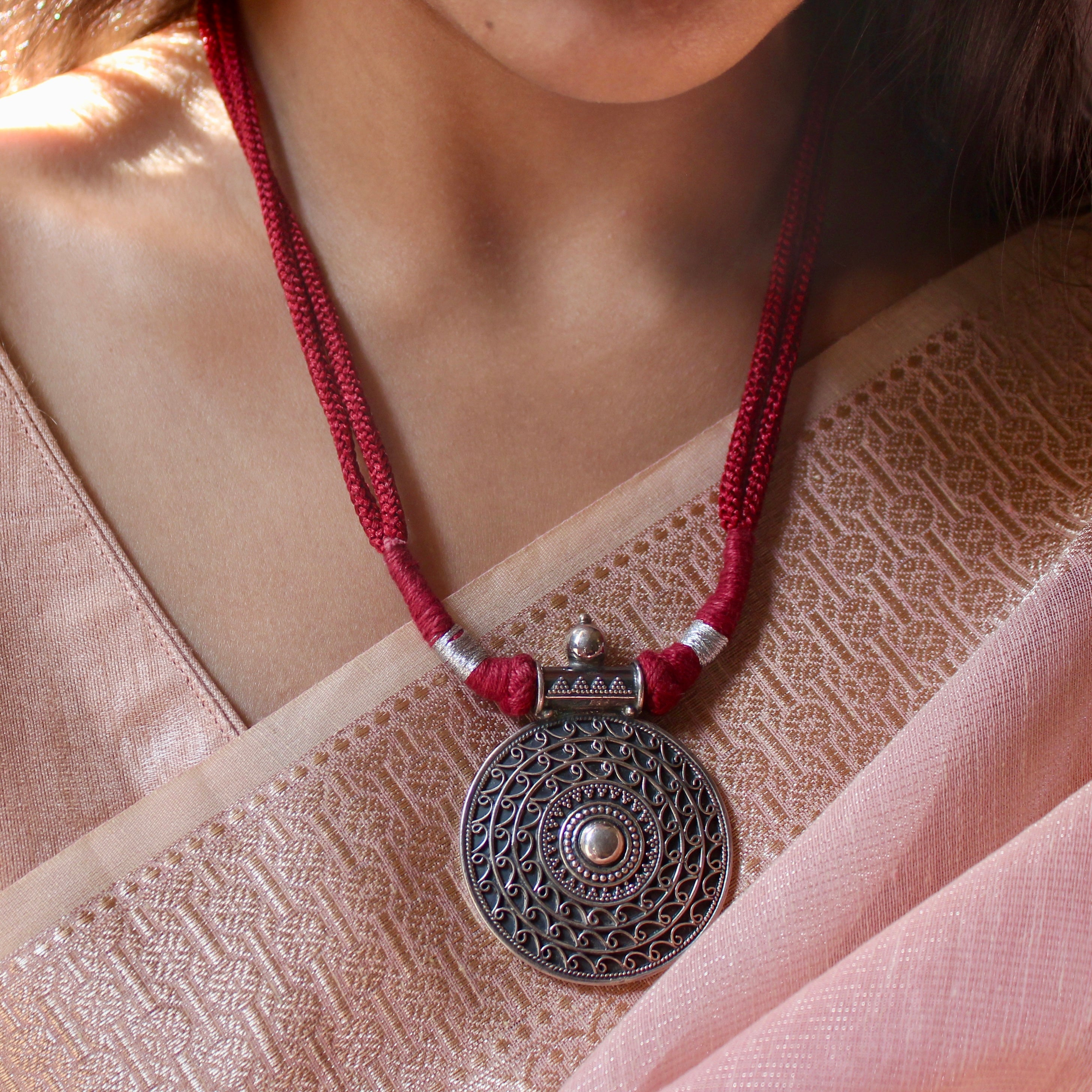 Oxidised circle pattered 925 silver with red dori necklace