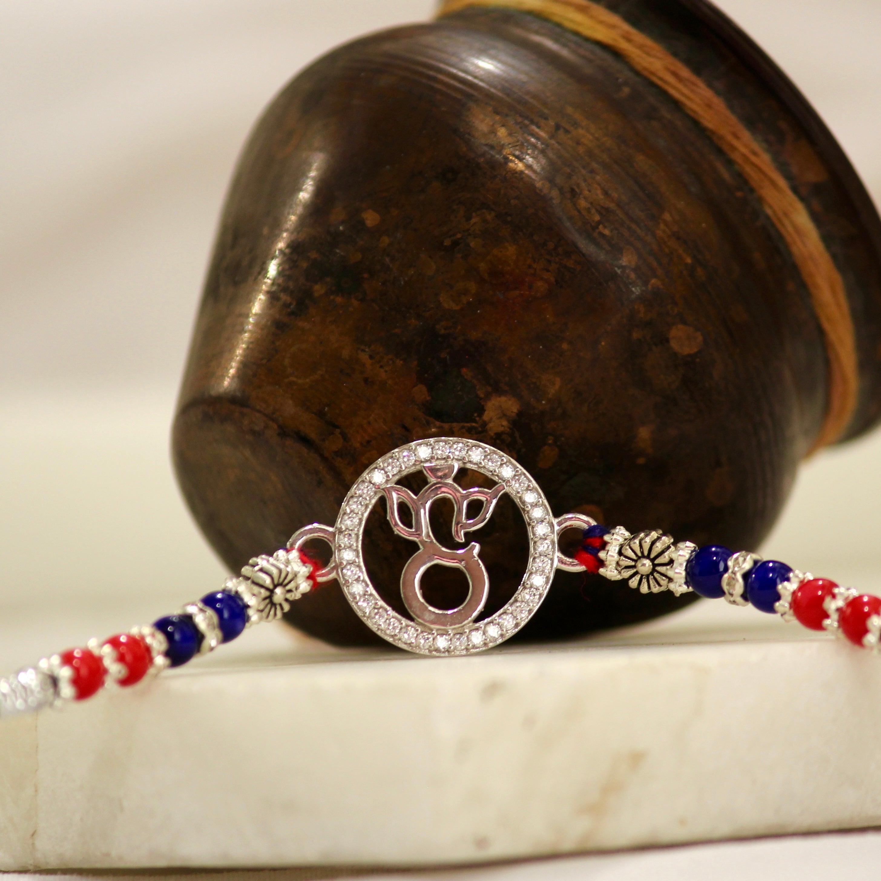 LORD GANESHA IN CIRCLE 925 silver red thread rakhi