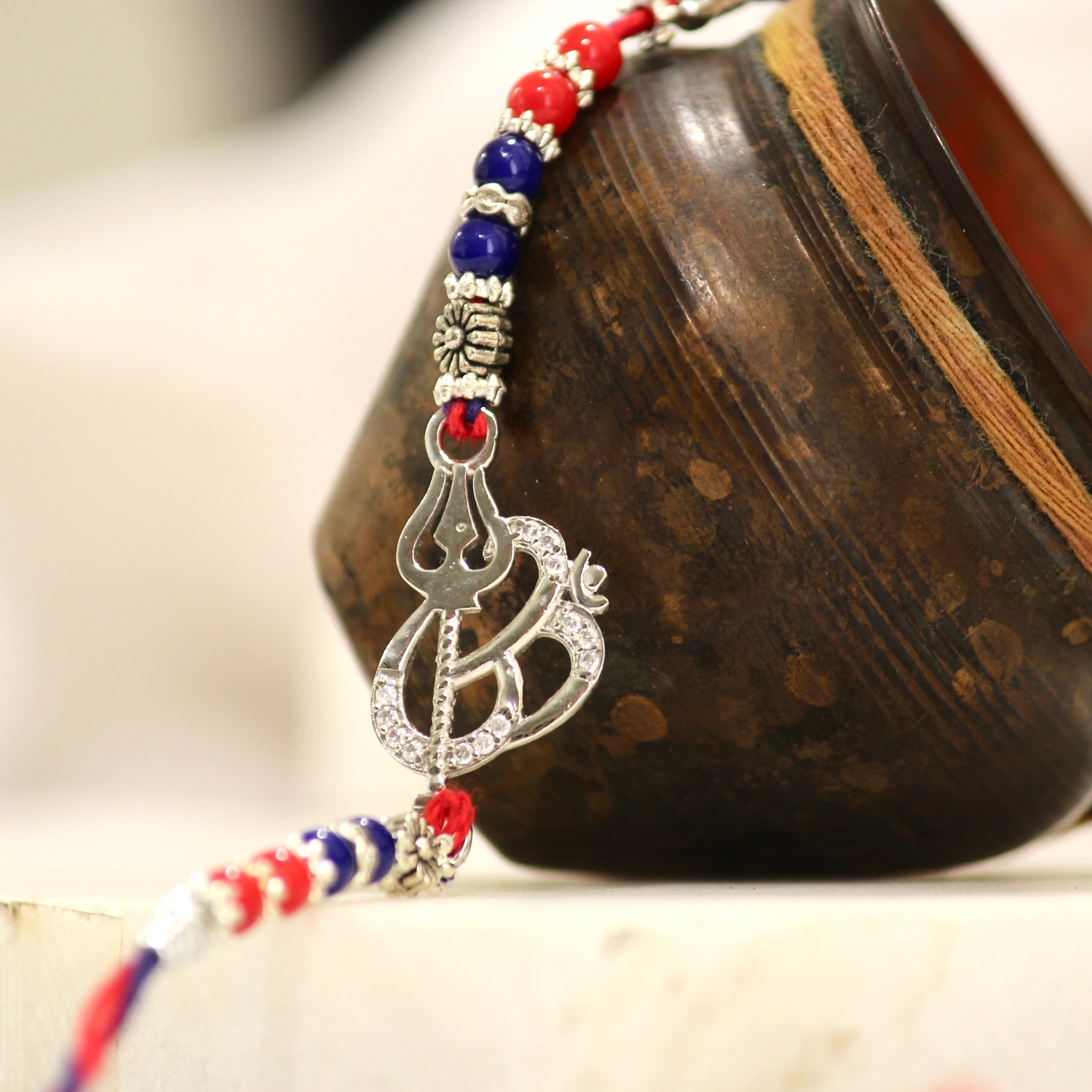 OM WITH TRISHUL 925 silver red thread rakhi