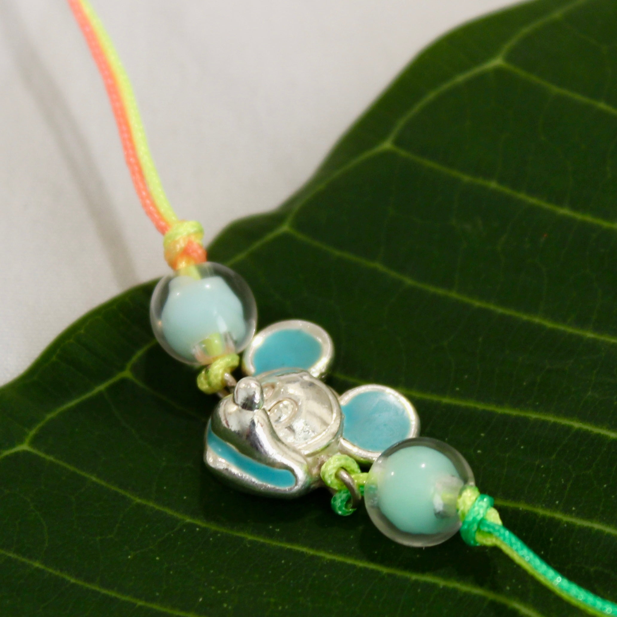 Mickey multi-colored thread rakhi in 925 silver