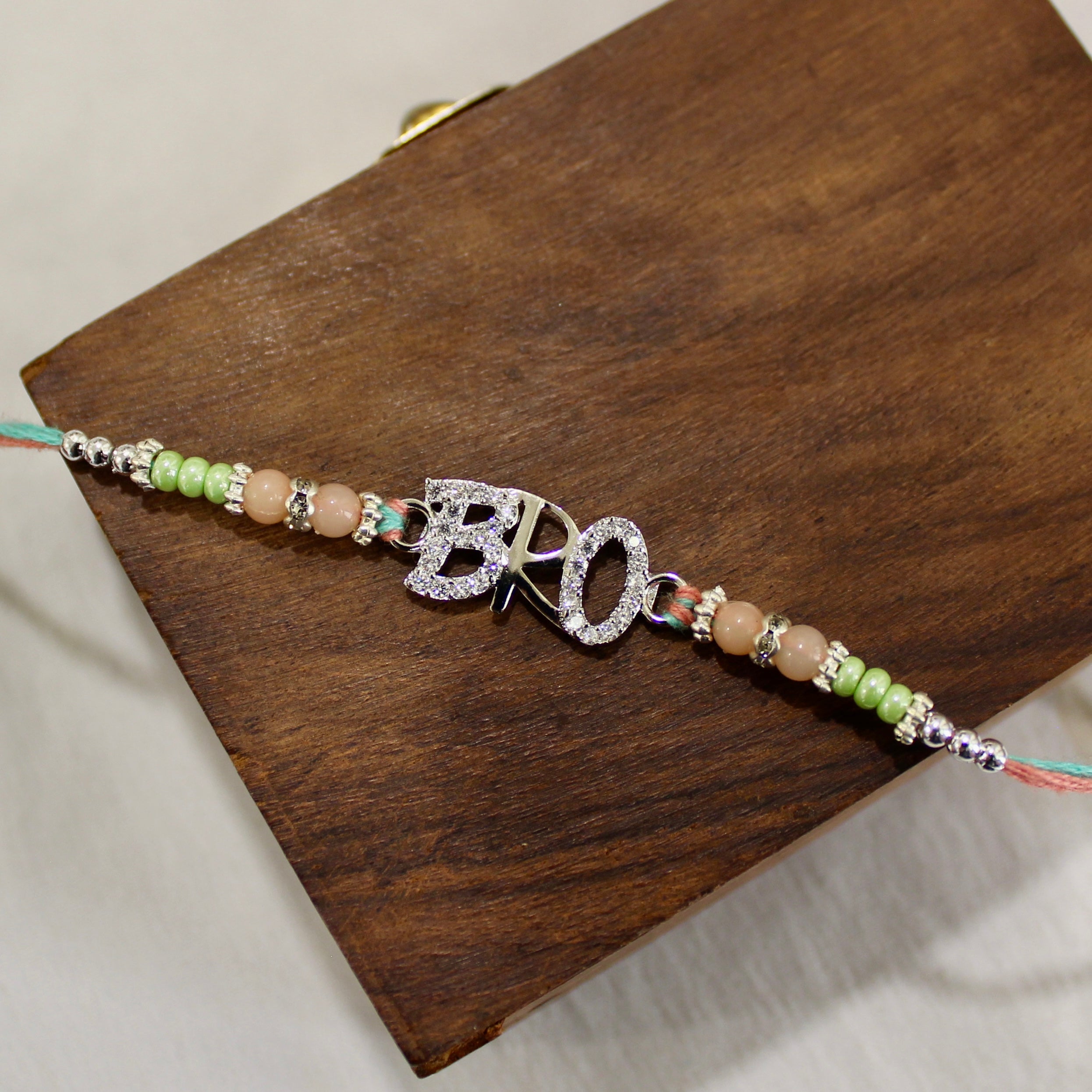 BRO 925 silver peach thread rakhi