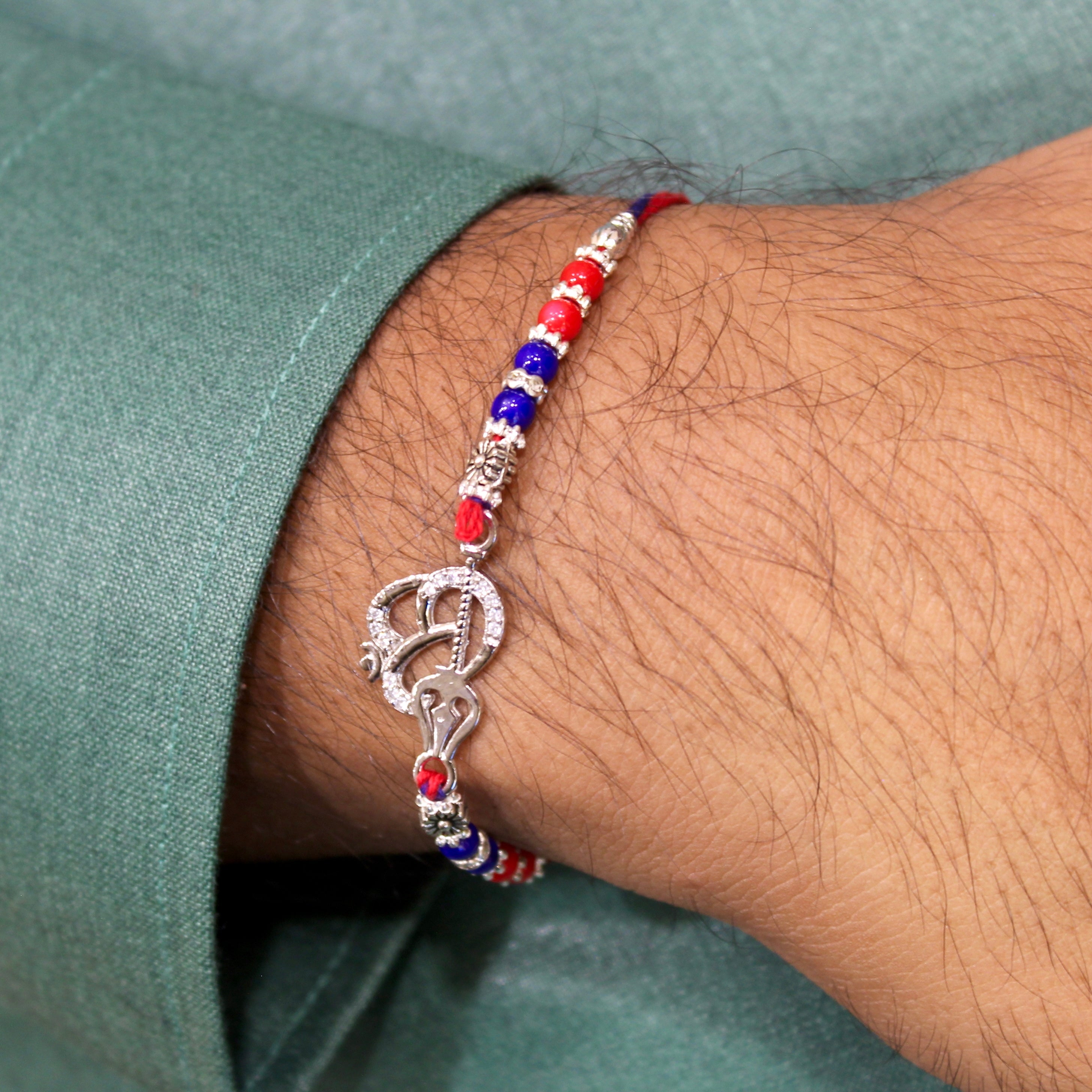 OM WITH TRISHUL 925 silver red thread rakhi