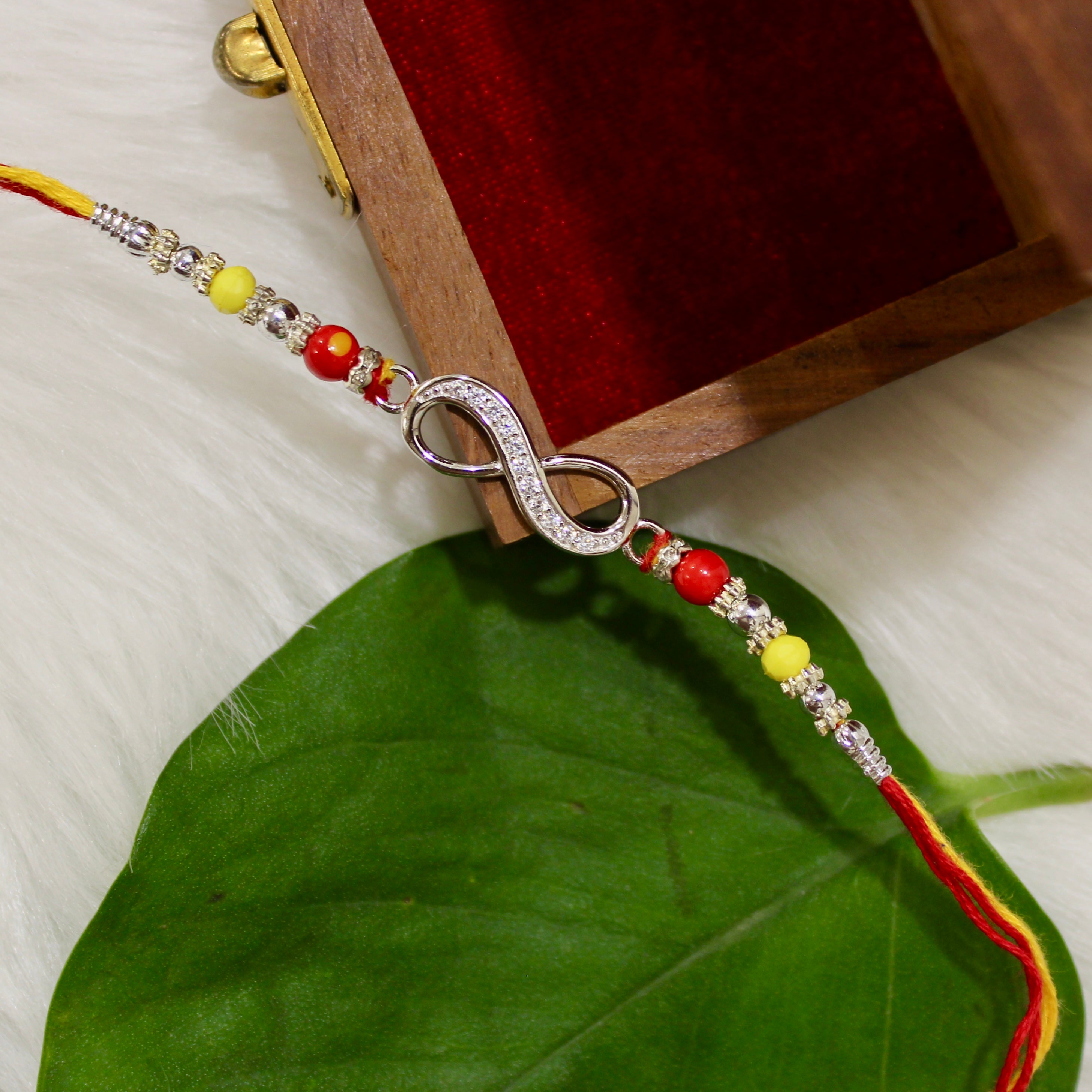 Infinity Silver Yellow Red Thread Rakhi In 925 Silver