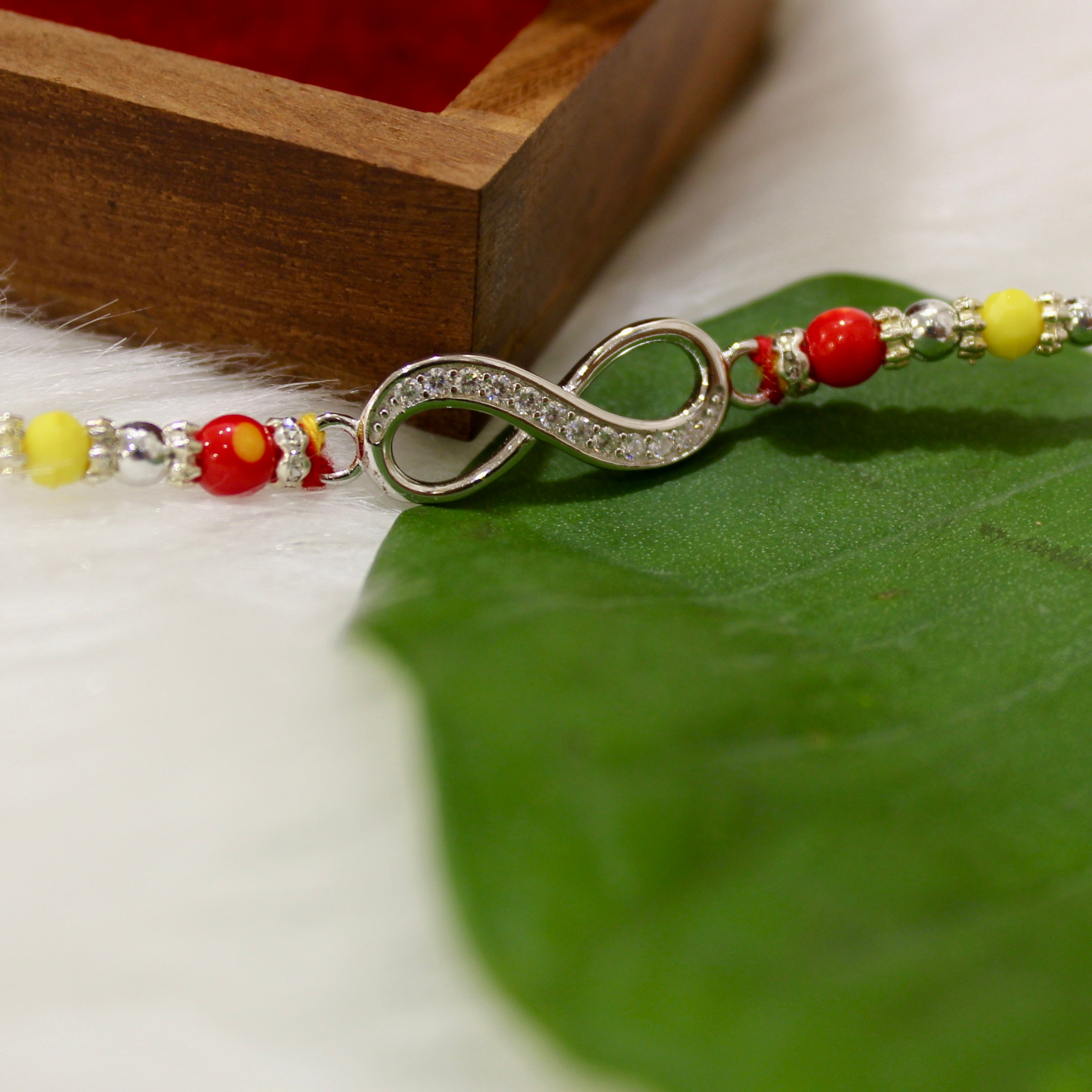 Infinity Silver Yellow Red Thread Rakhi In 925 Silver