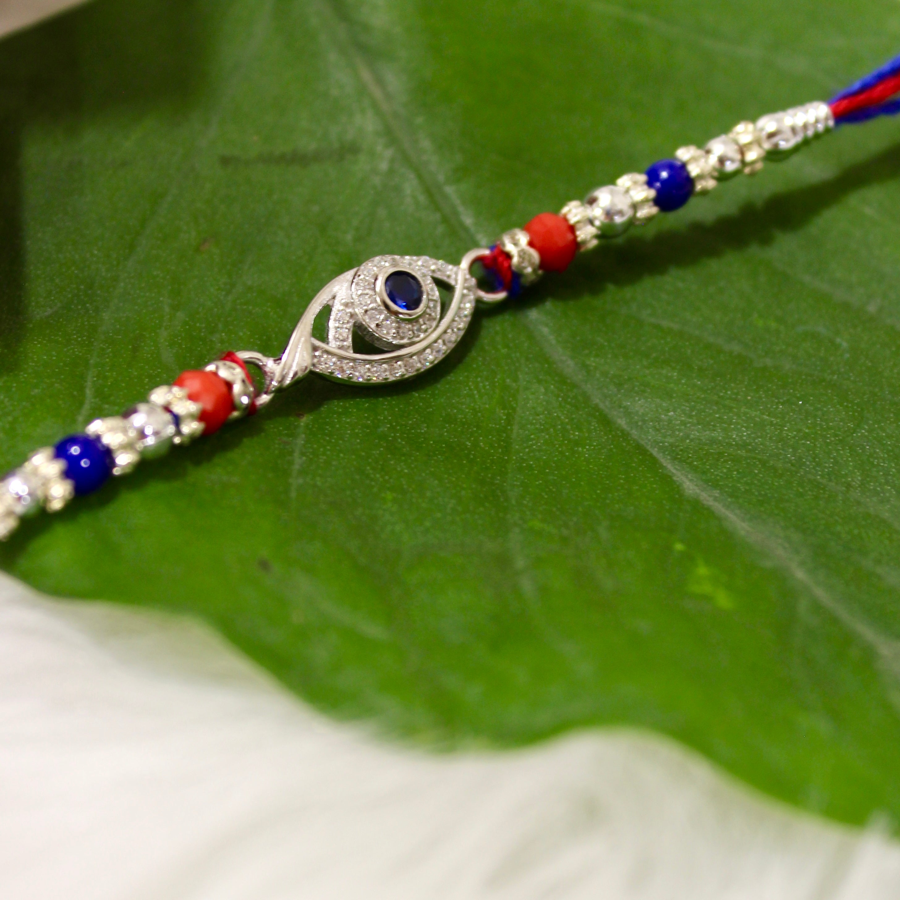 Evil Eye Charm Blue Thread Rakhi In 925 Silver