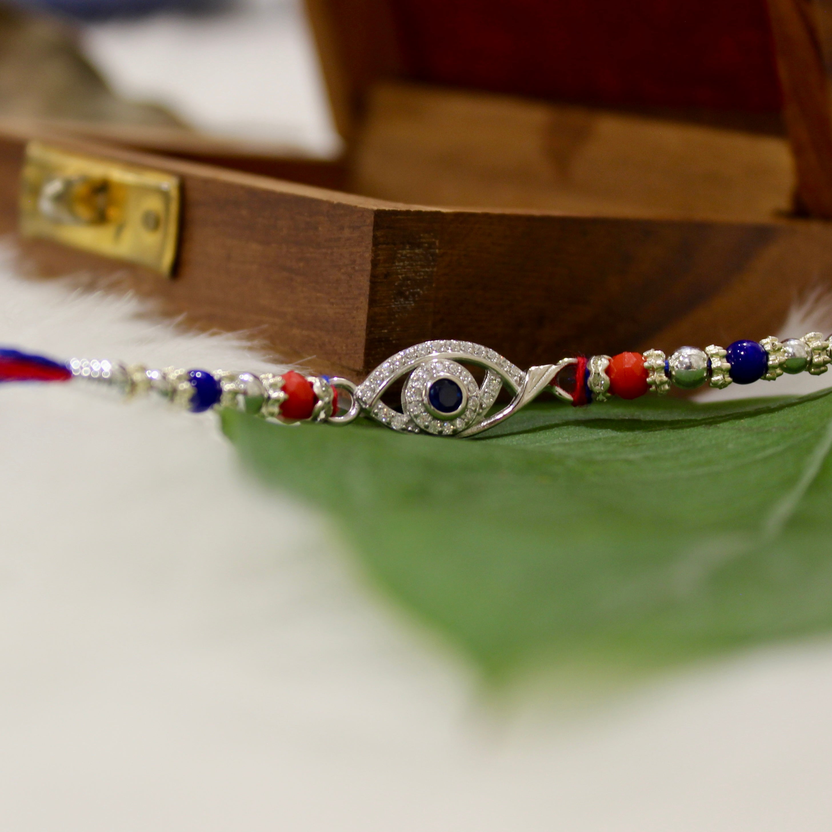 Evil Eye Charm Blue Thread Rakhi In 925 Silver