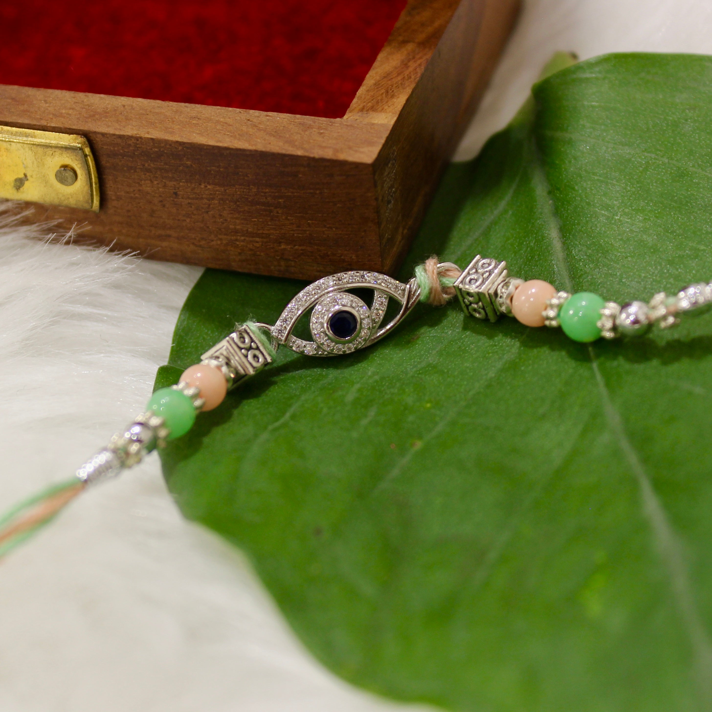 Evil Eye Charm Green Thread Rakhi In 925 Silver