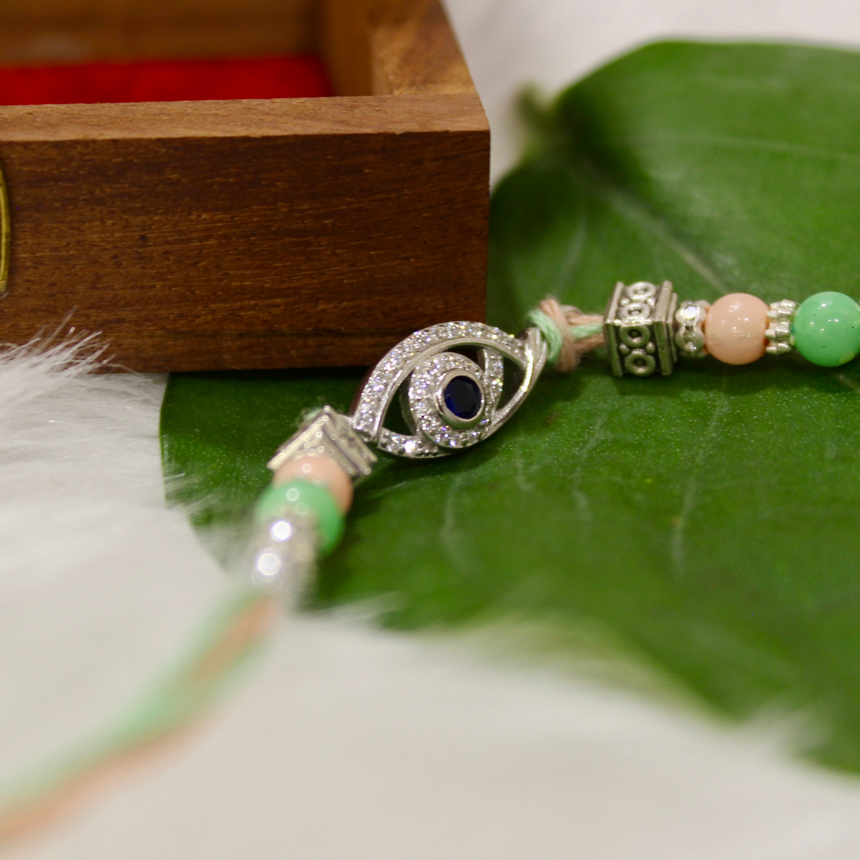 Evil Eye Charm Green Thread Rakhi In 925 Silver