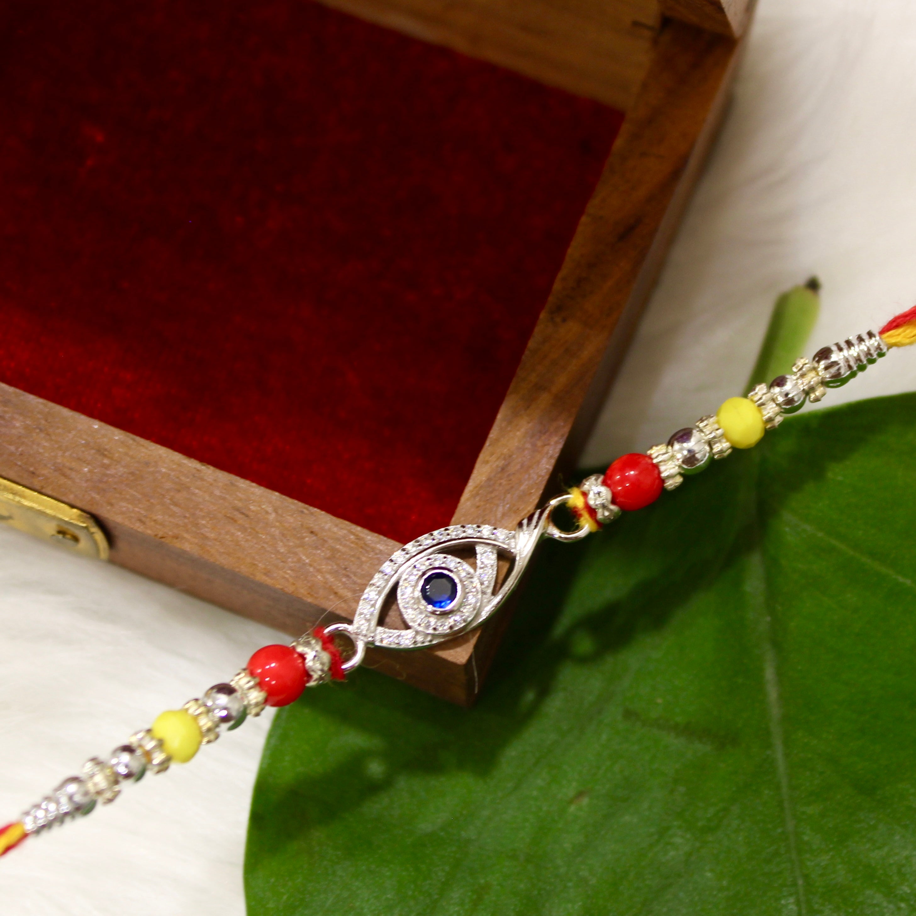 Evil Eye Charm Yellow Thread Rakhi In 925 Silver
