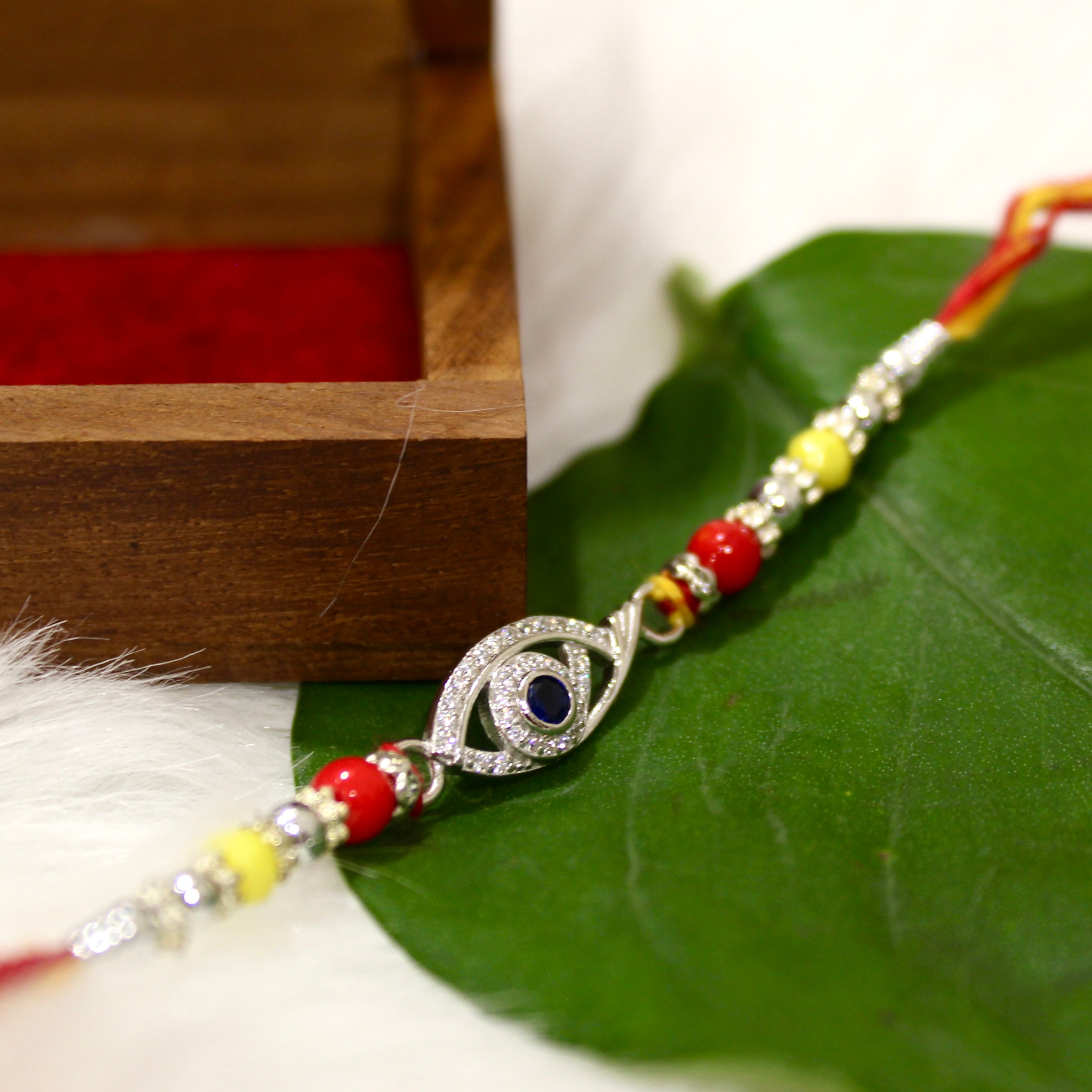Evil Eye Charm Yellow Thread Rakhi In 925 Silver