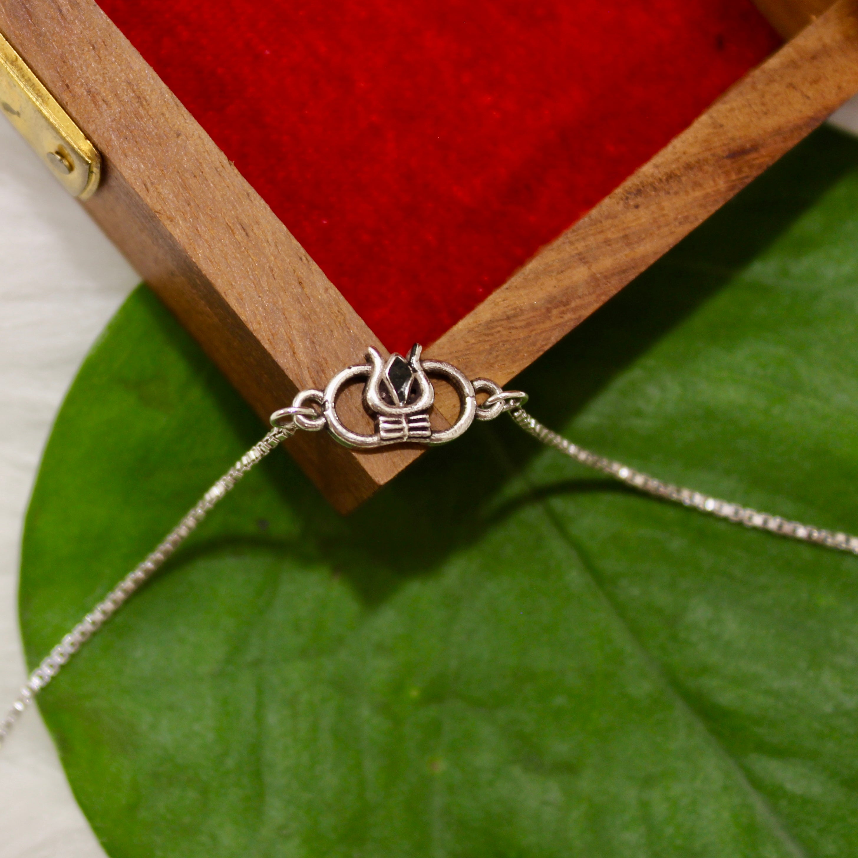 Trishul Mini Charm Chained Rakhi In 925 Silver