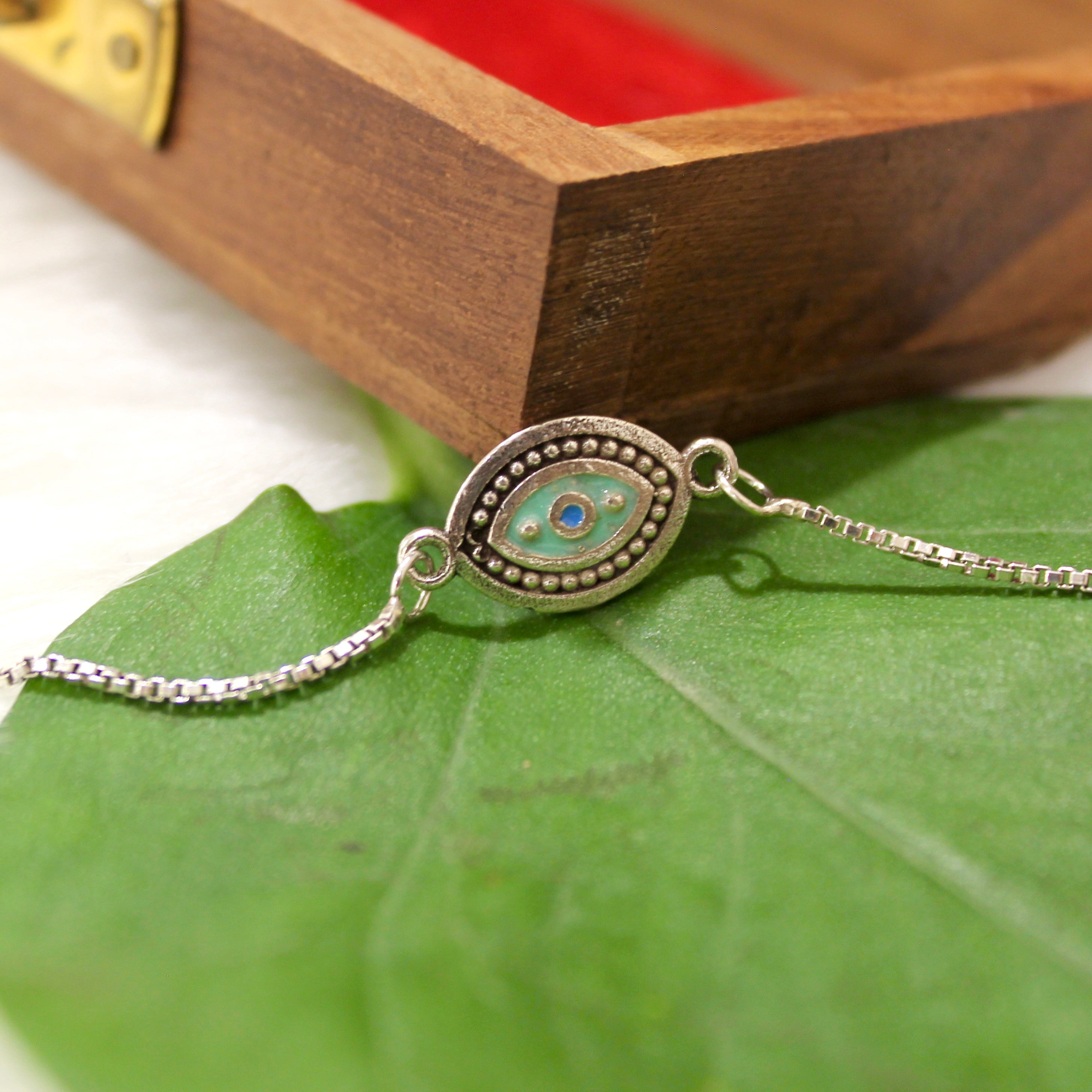 Aqua Evil Eye Chained Rakhi In 925 Silver