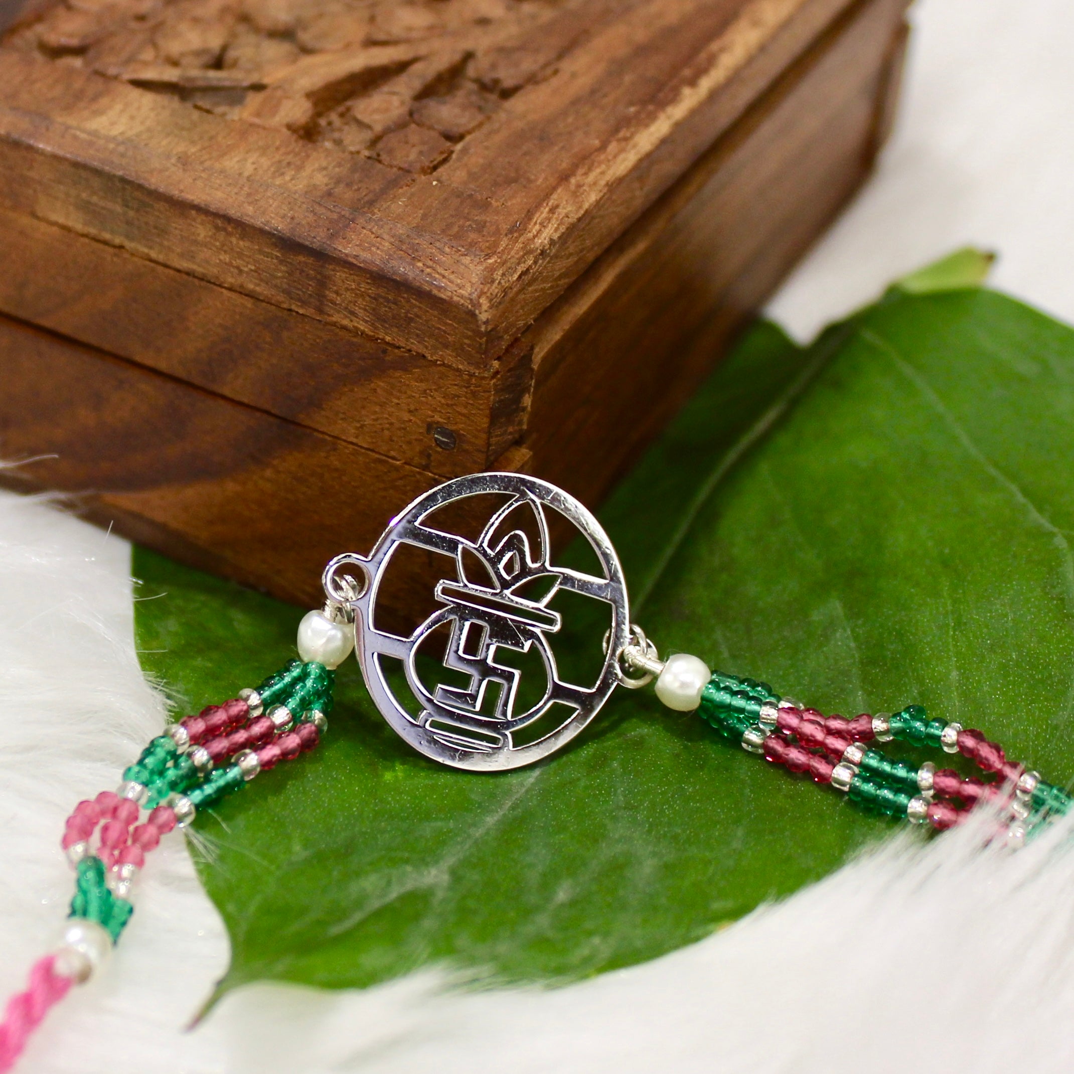 Satiya with kalash Pink Thread Rakhi in 925 Silver