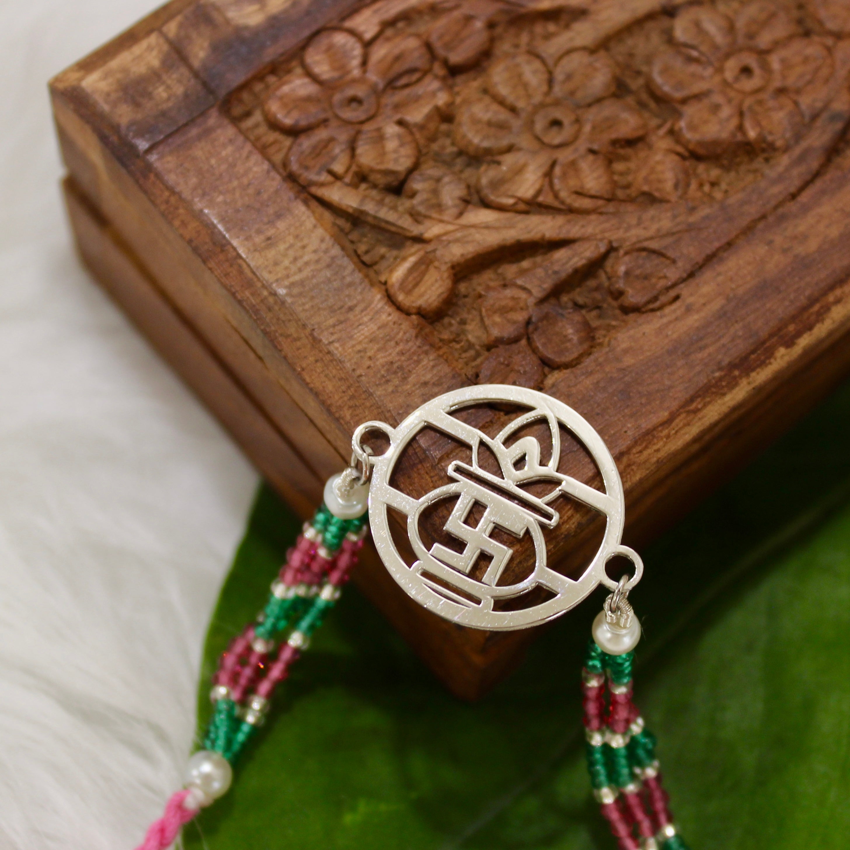 Satiya with kalash Pink Thread Rakhi in 925 Silver