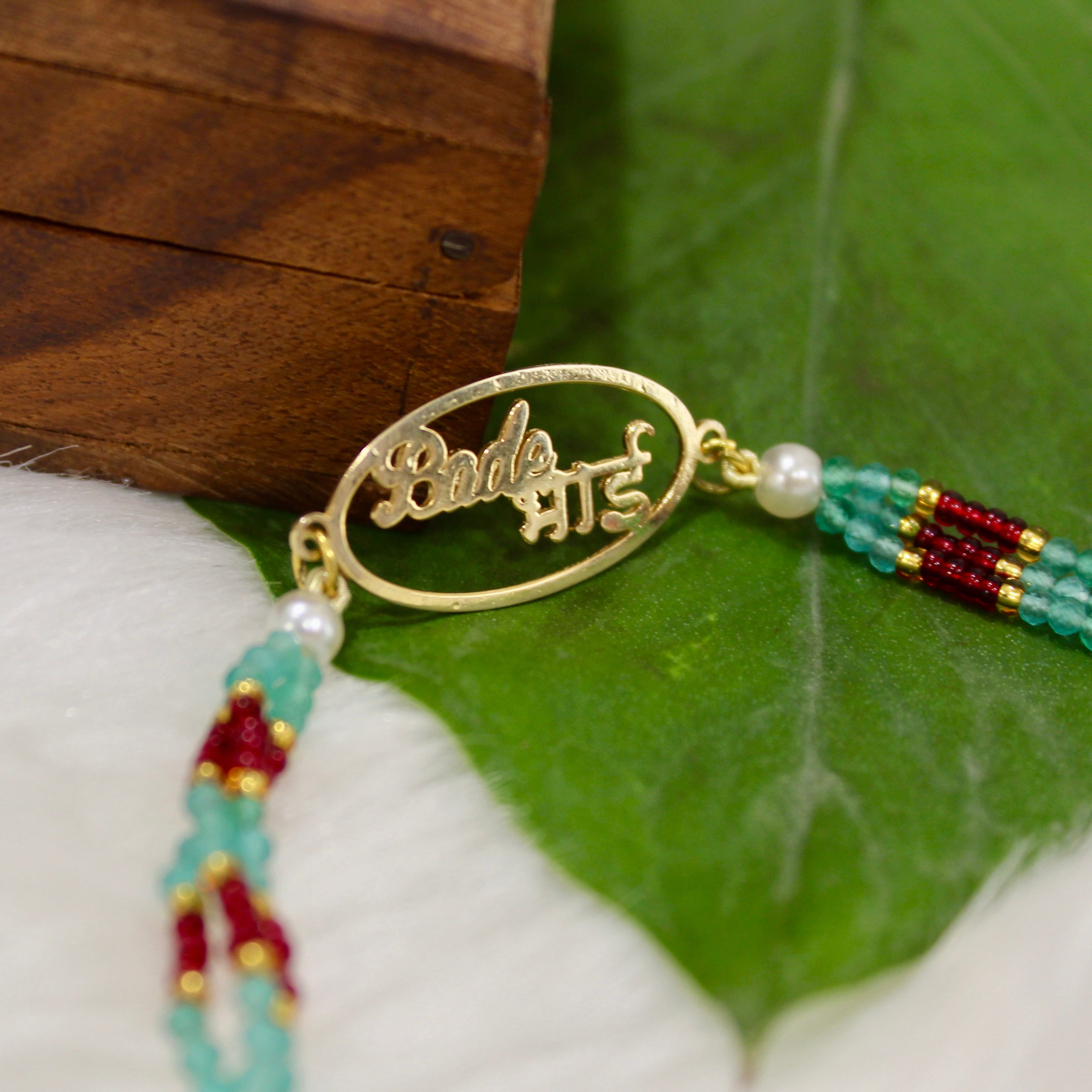 Bade Bhai In Circle Gold Polish Maroon Thread Rakhi In 925 Silver