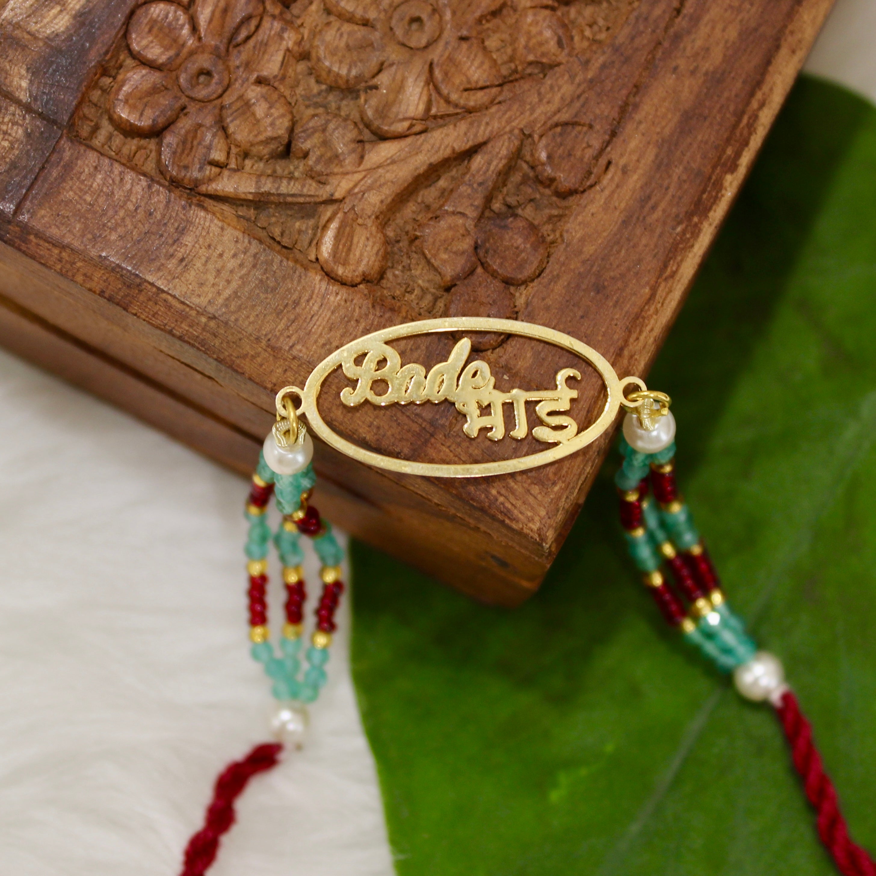 Bade Bhai in Circle Gold Polish Maroon Thread and Pyari Bhabhi Pink Thread Rakhi in 925 Silver
