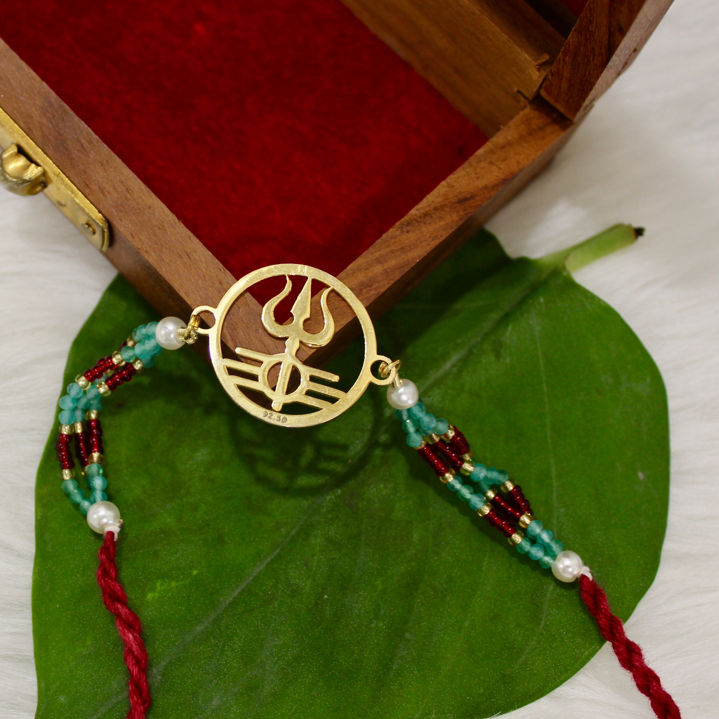 Trishul In Circle Gold Polish Maroon Thread Rakhi In 925 Silver