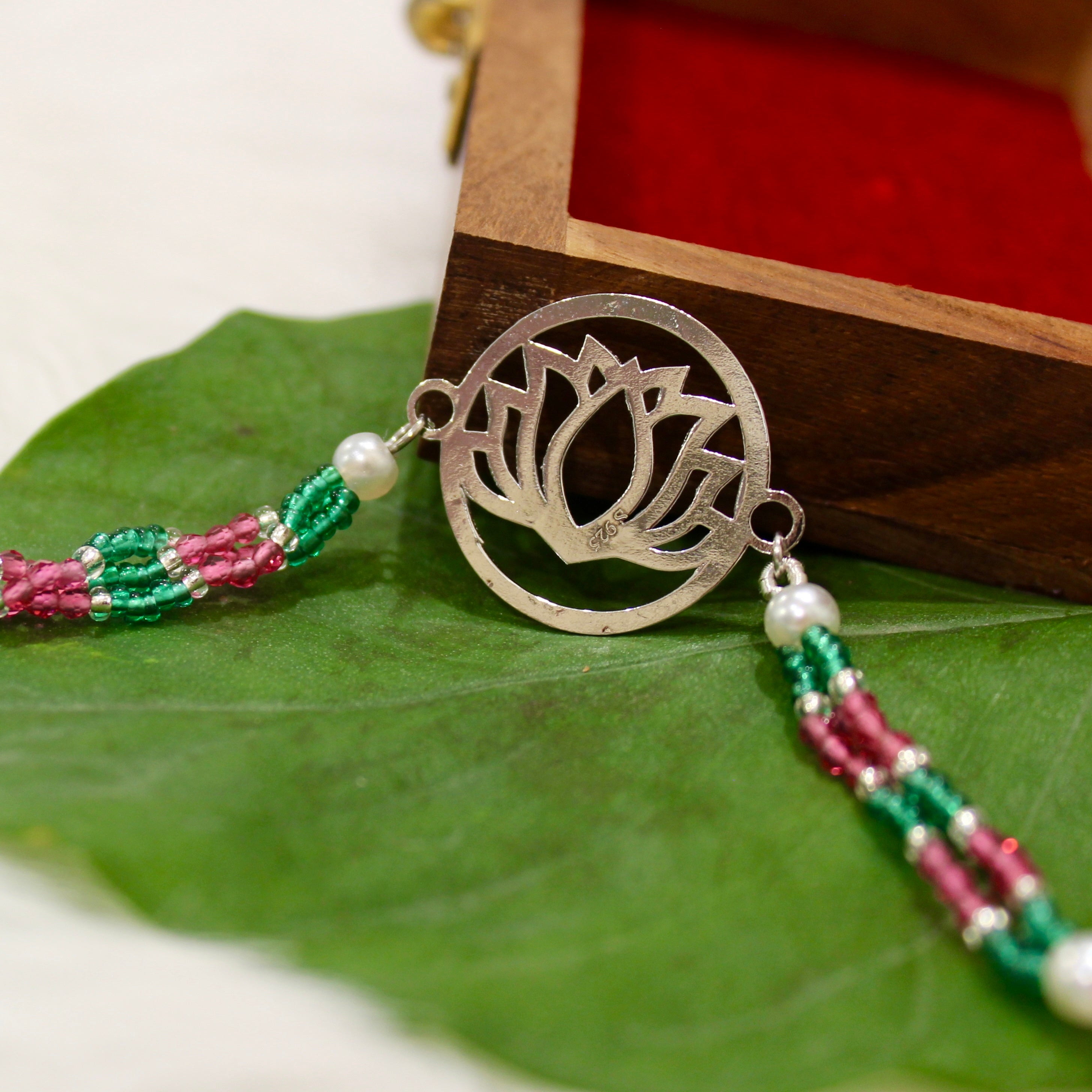 Lotus in Silver Polish Pink Thread and Pyari Bhabhi Pink Thread Rakhi in 925 silver