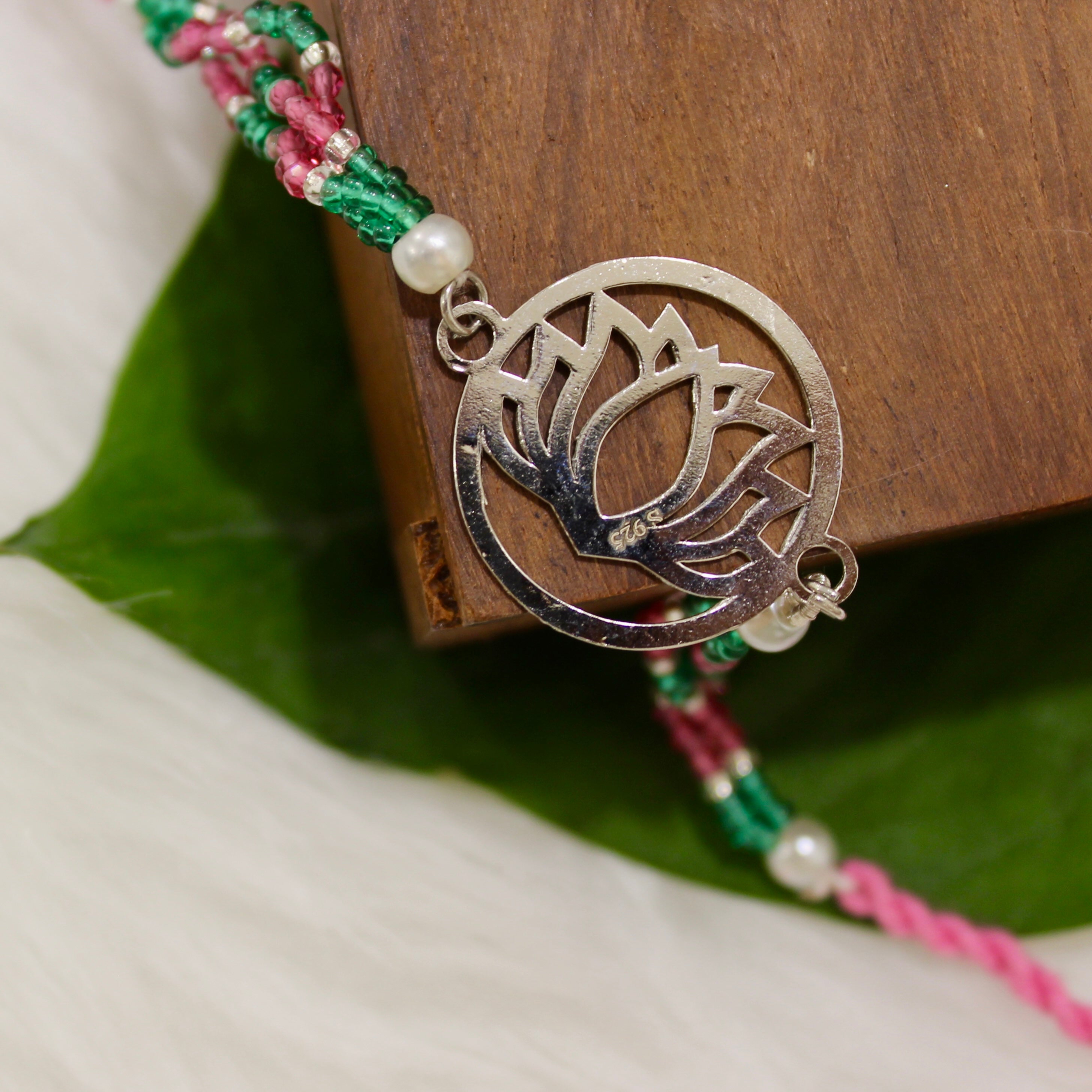 Lotus In Silver Polish Pink Thread Rakhi In 925 Silver