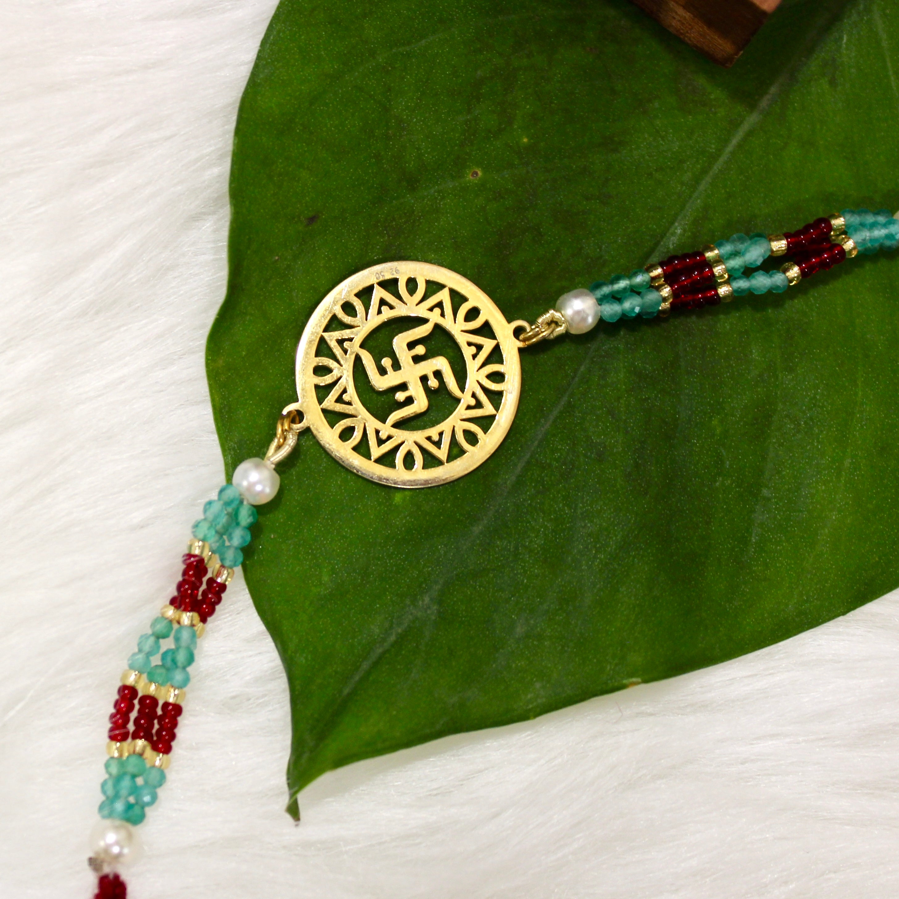Satiya In Gold Polish Maroon Thread Rakhi In 925 Silver