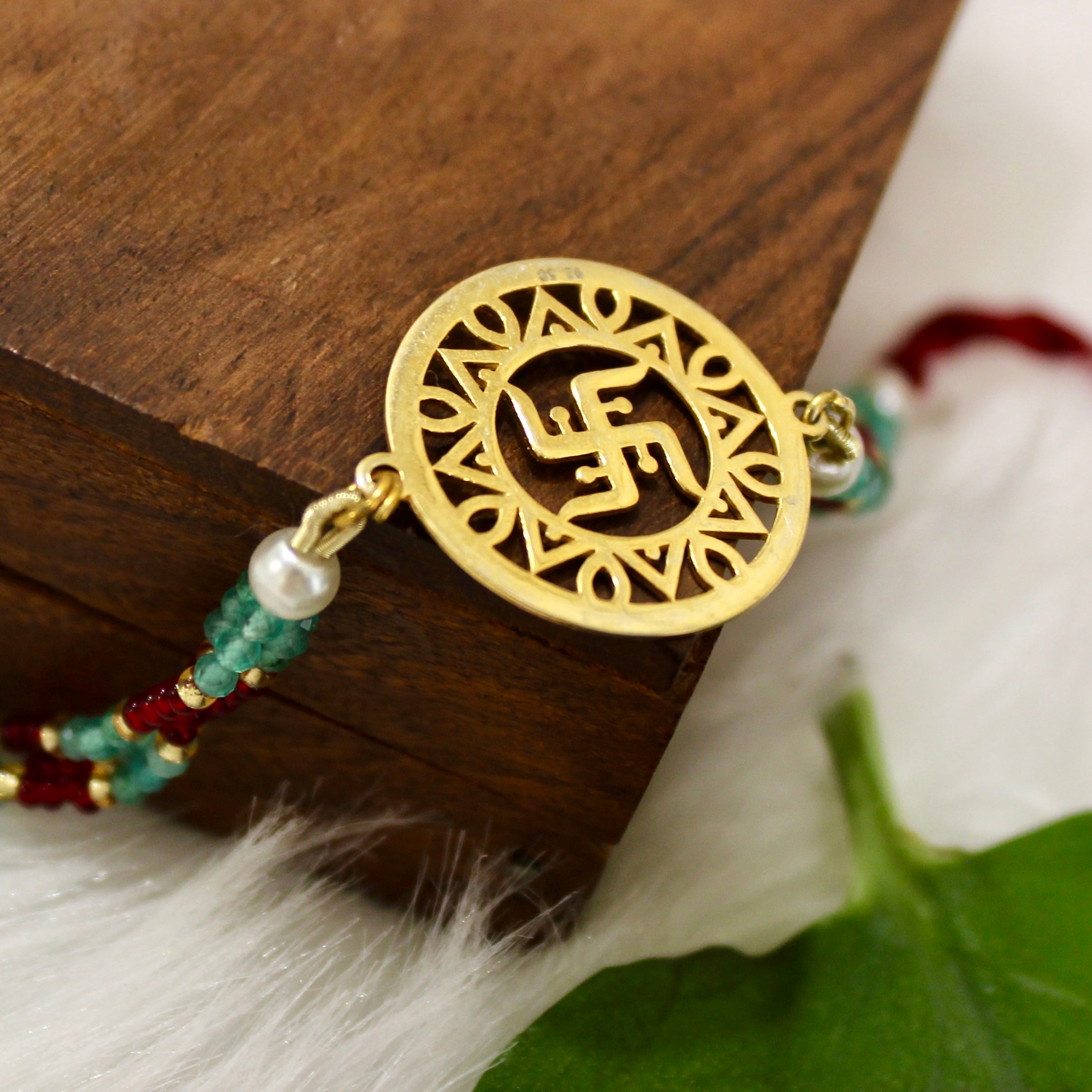 Satiya In Gold Polish Maroon Thread Rakhi In 925 Silver